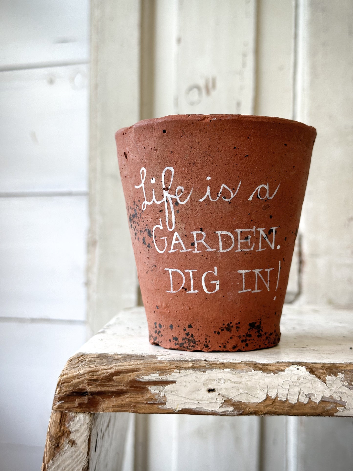 A Victorian terracotta pot with a quote