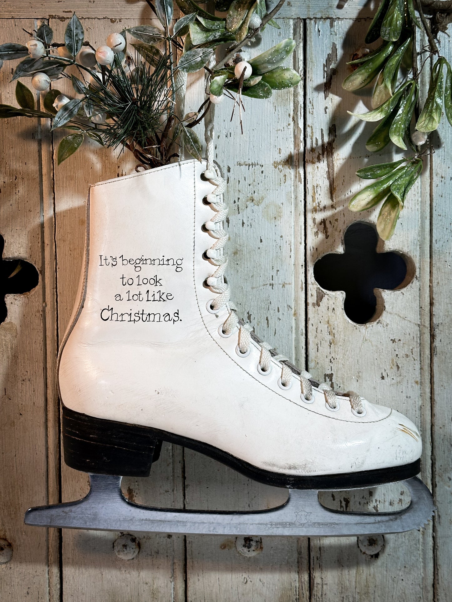 A beautiful vintage Christmas ice skate hand painted using traditional sign writer’s techniques and materials