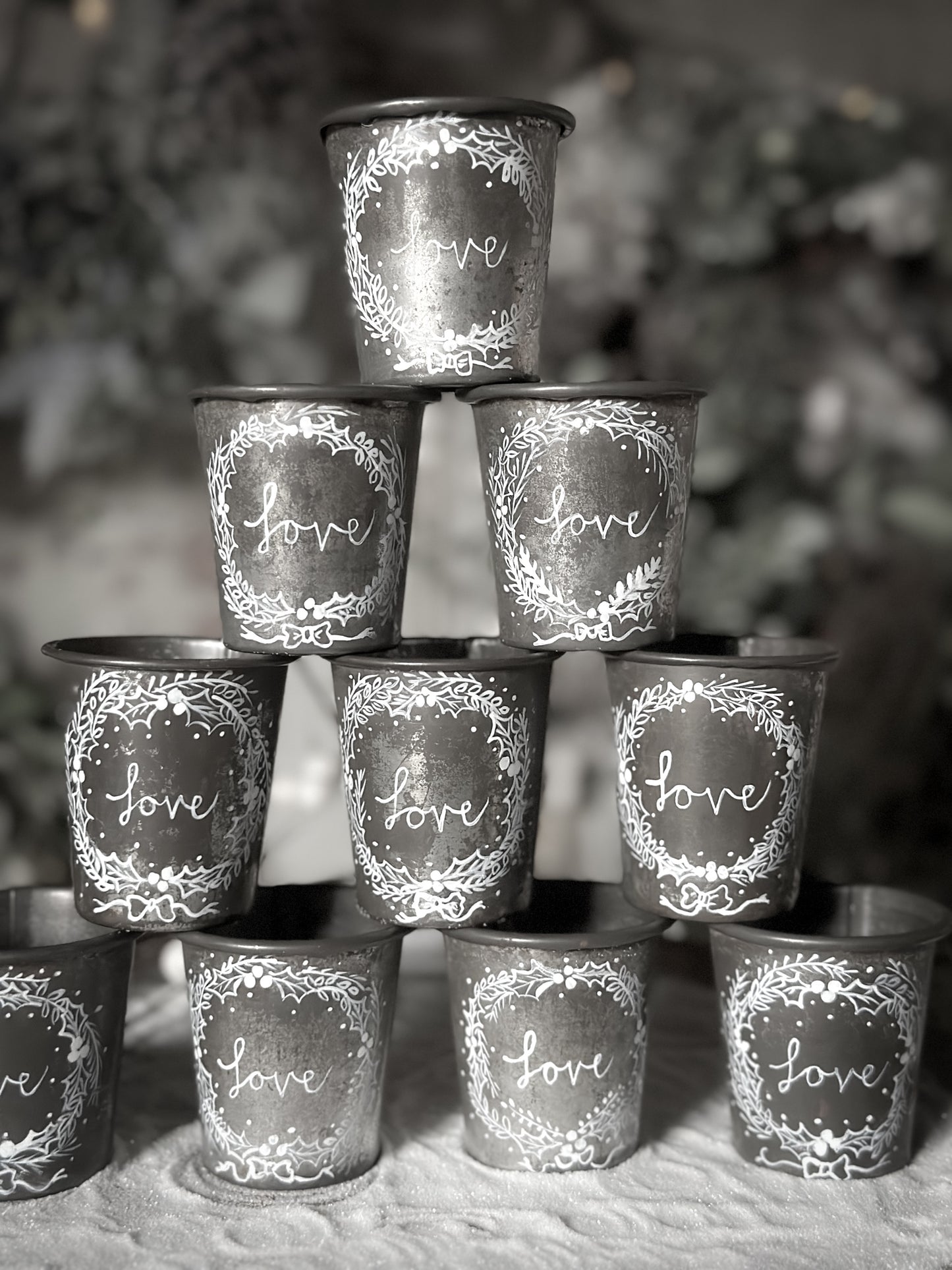 A pretty hand painted Dariole tin tea light holder