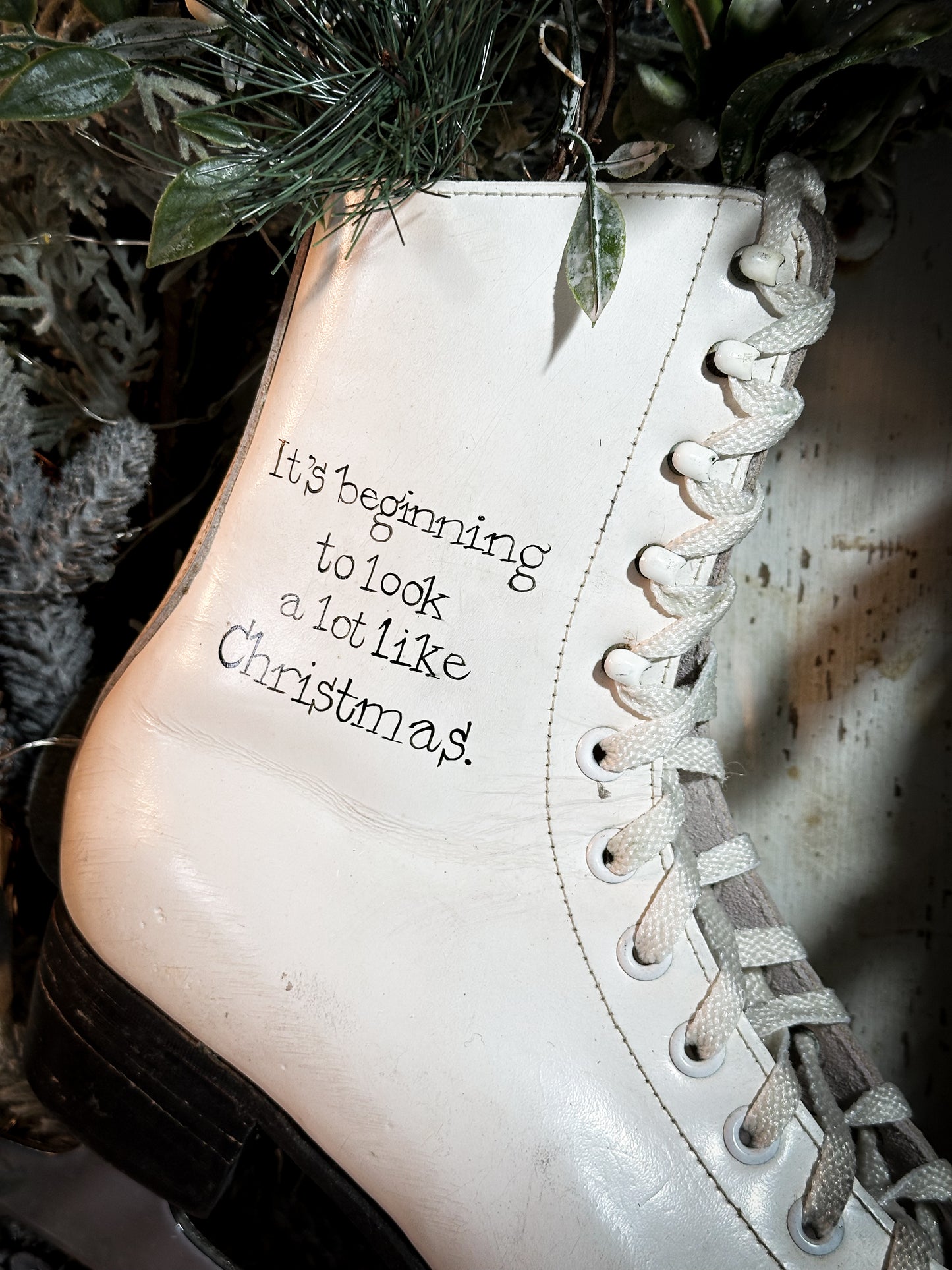 A beautiful vintage Christmas ice skate hand painted using traditional sign writer’s techniques and materials