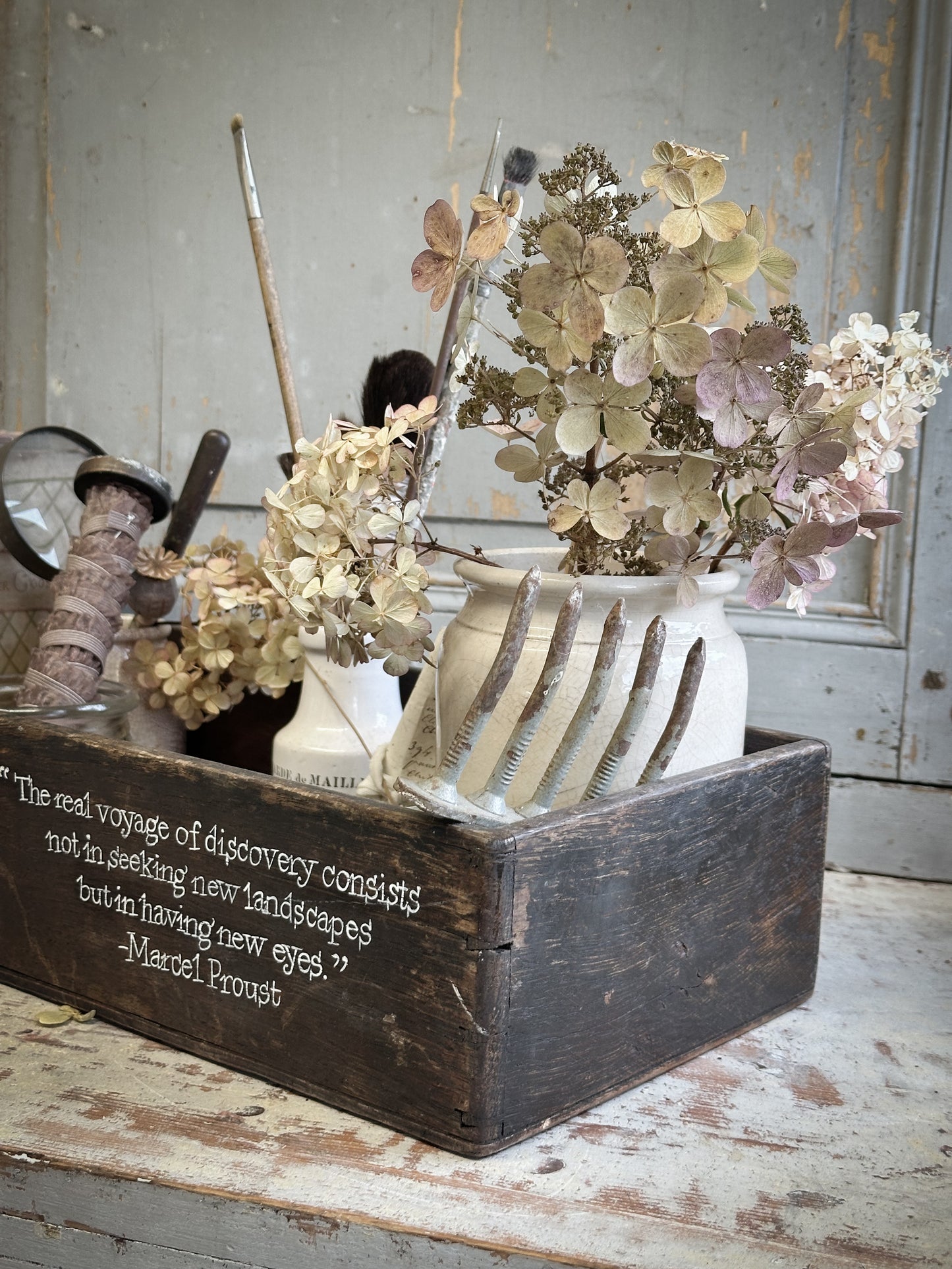 A Vintage Wooden Crate With Hand Painted Quote