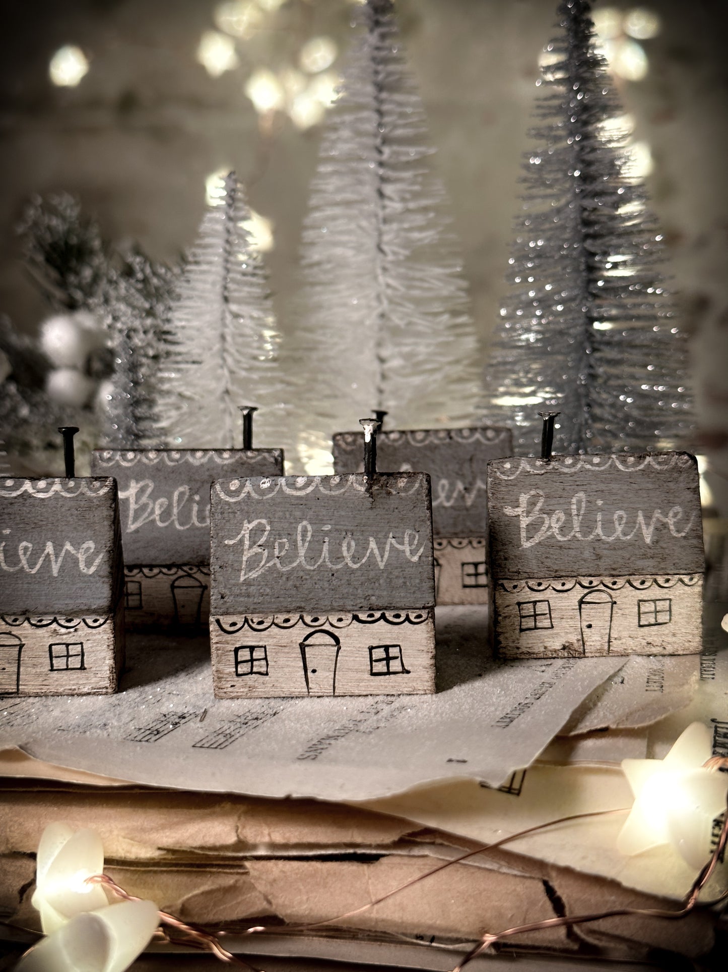 A pretty vintage German Erzgebirge Putz wooden village house painted with a Christmas quote