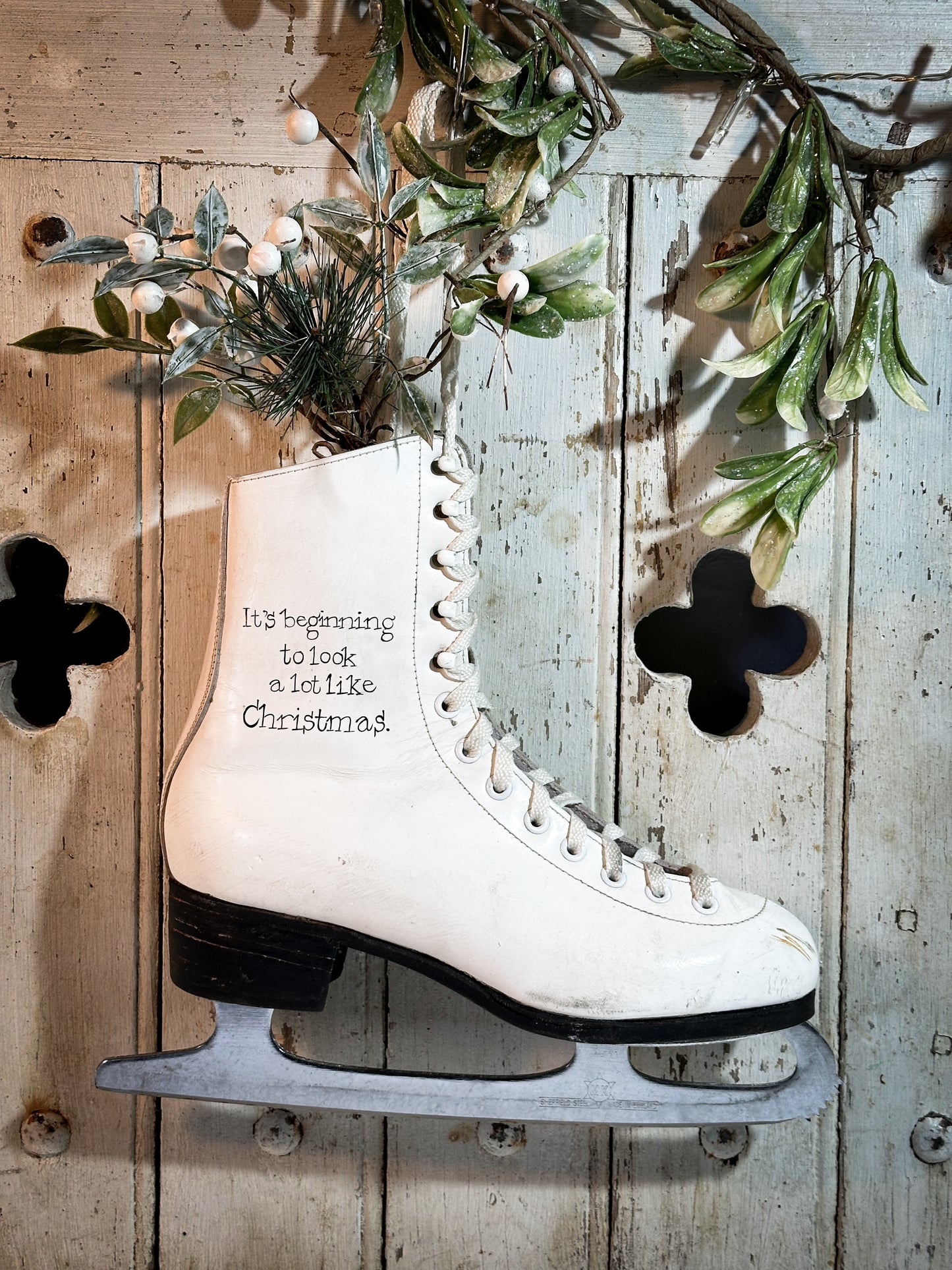 A beautiful vintage Christmas ice skate hand painted using traditional sign writer’s techniques and materials