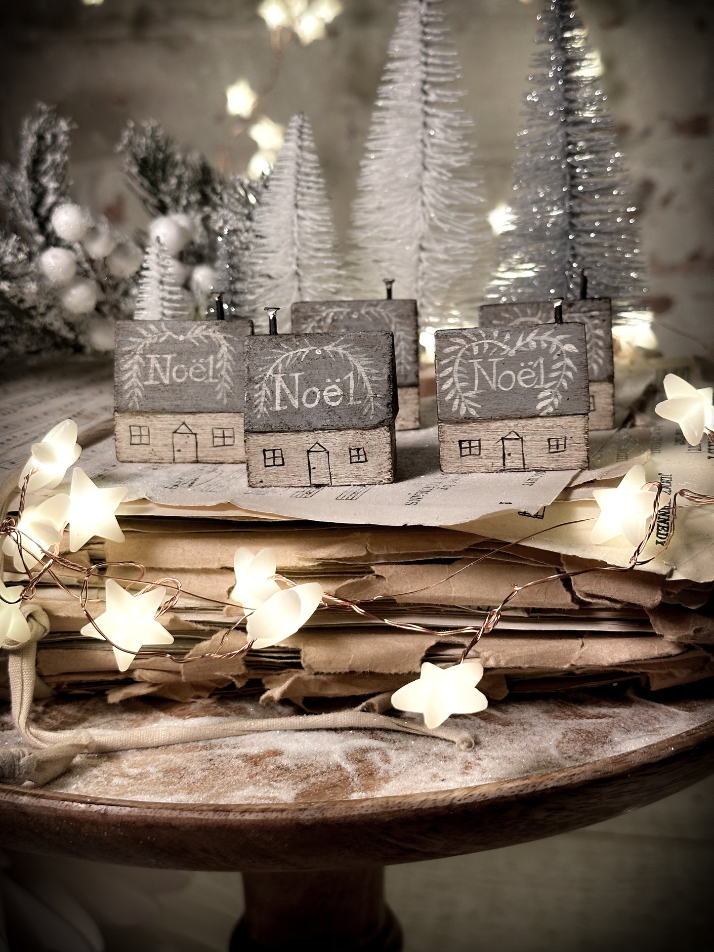 A pretty vintage German Erzgebirge Putz wooden village house painted with a Christmas quote