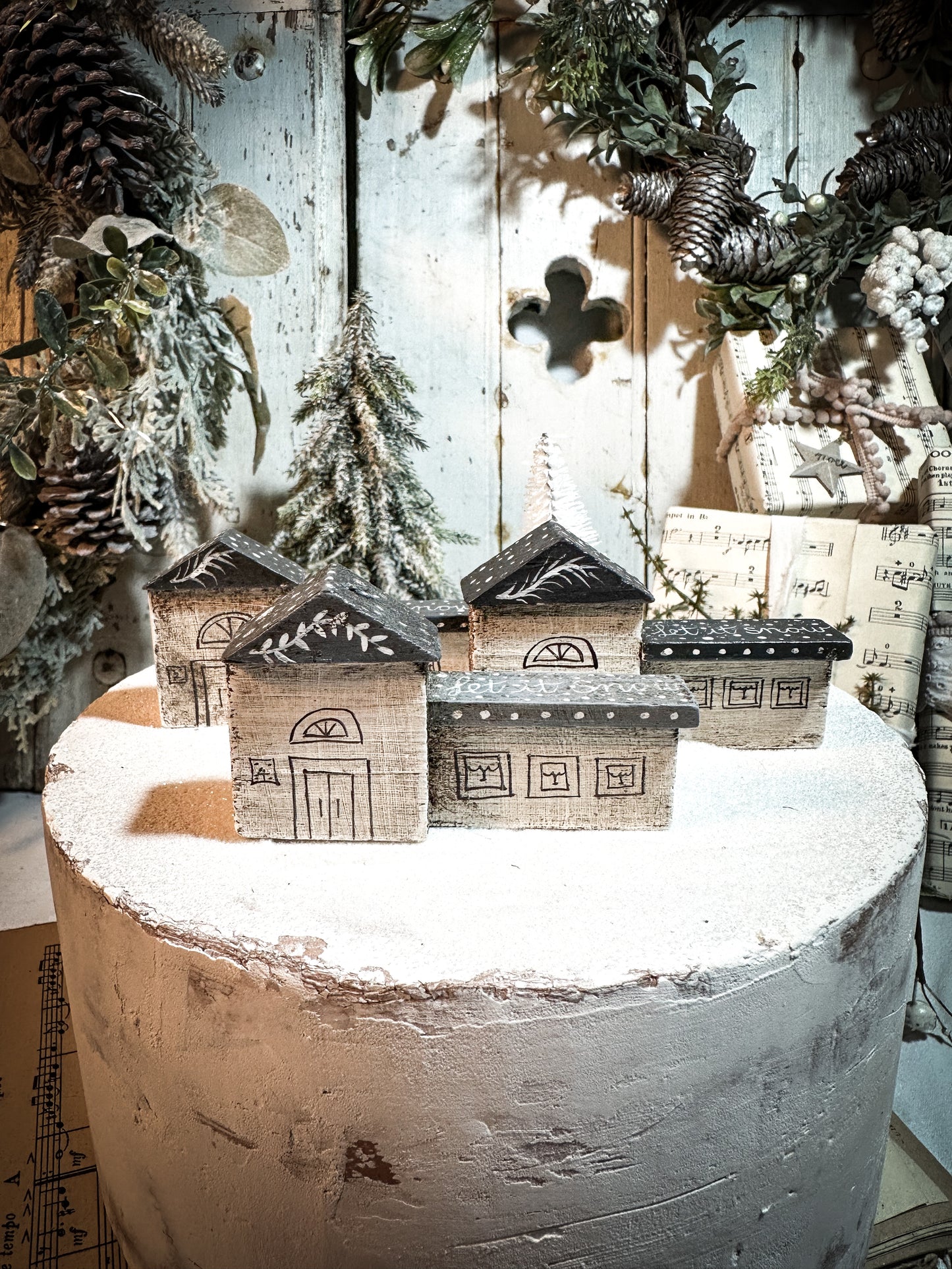 A pretty vintage German Erzgebirge Putz wooden village house painted with a Christmas quote