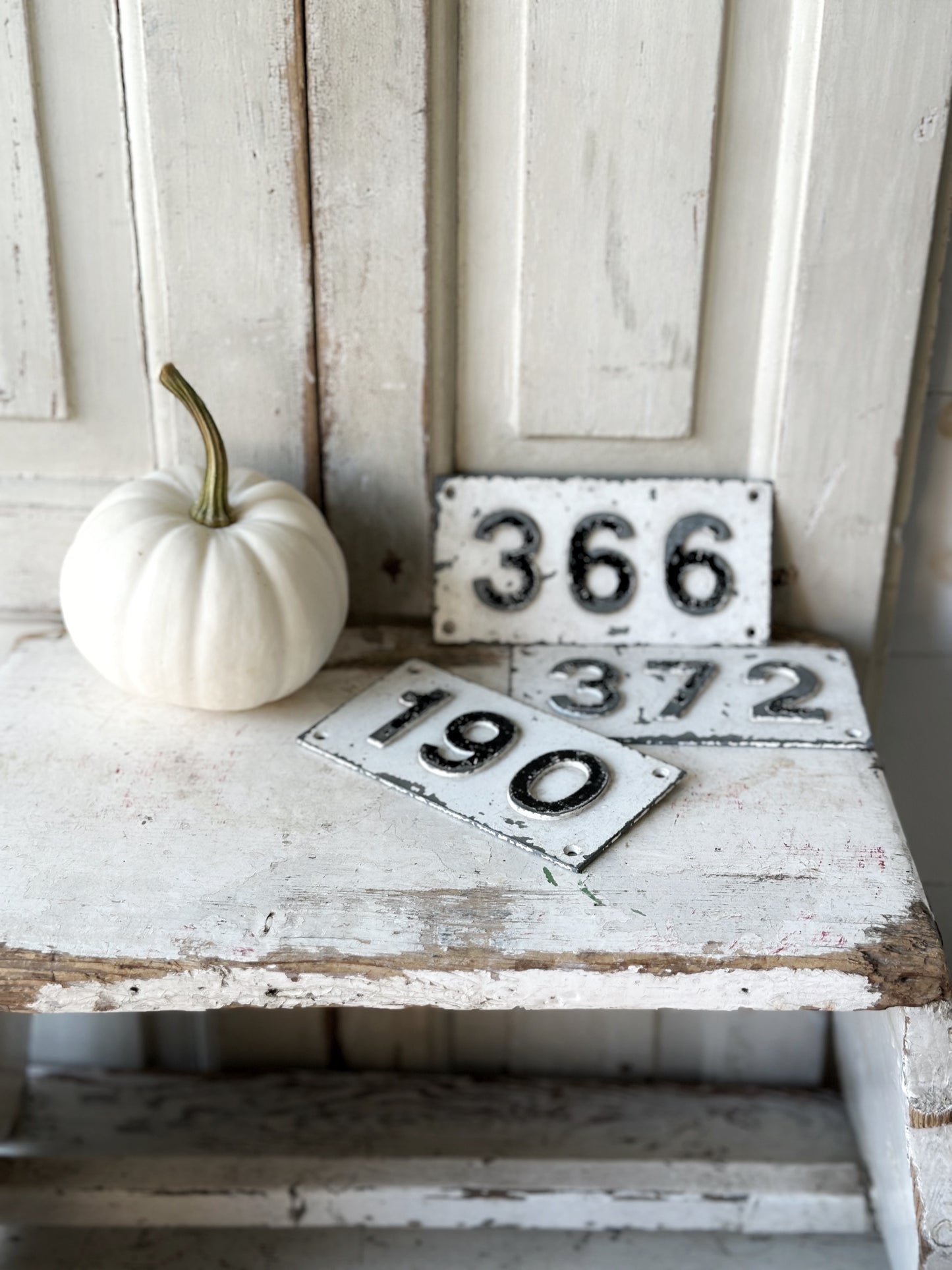 Three vintage French cast iron signs locker numbers