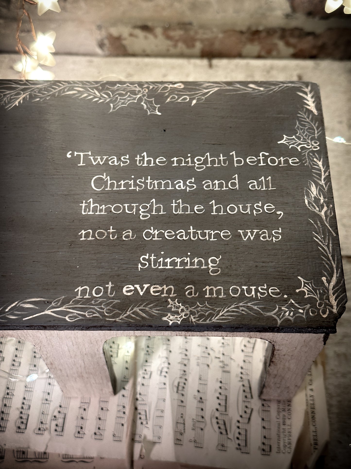 A hand painted quote on a vintage scratch built folk art model farm barn