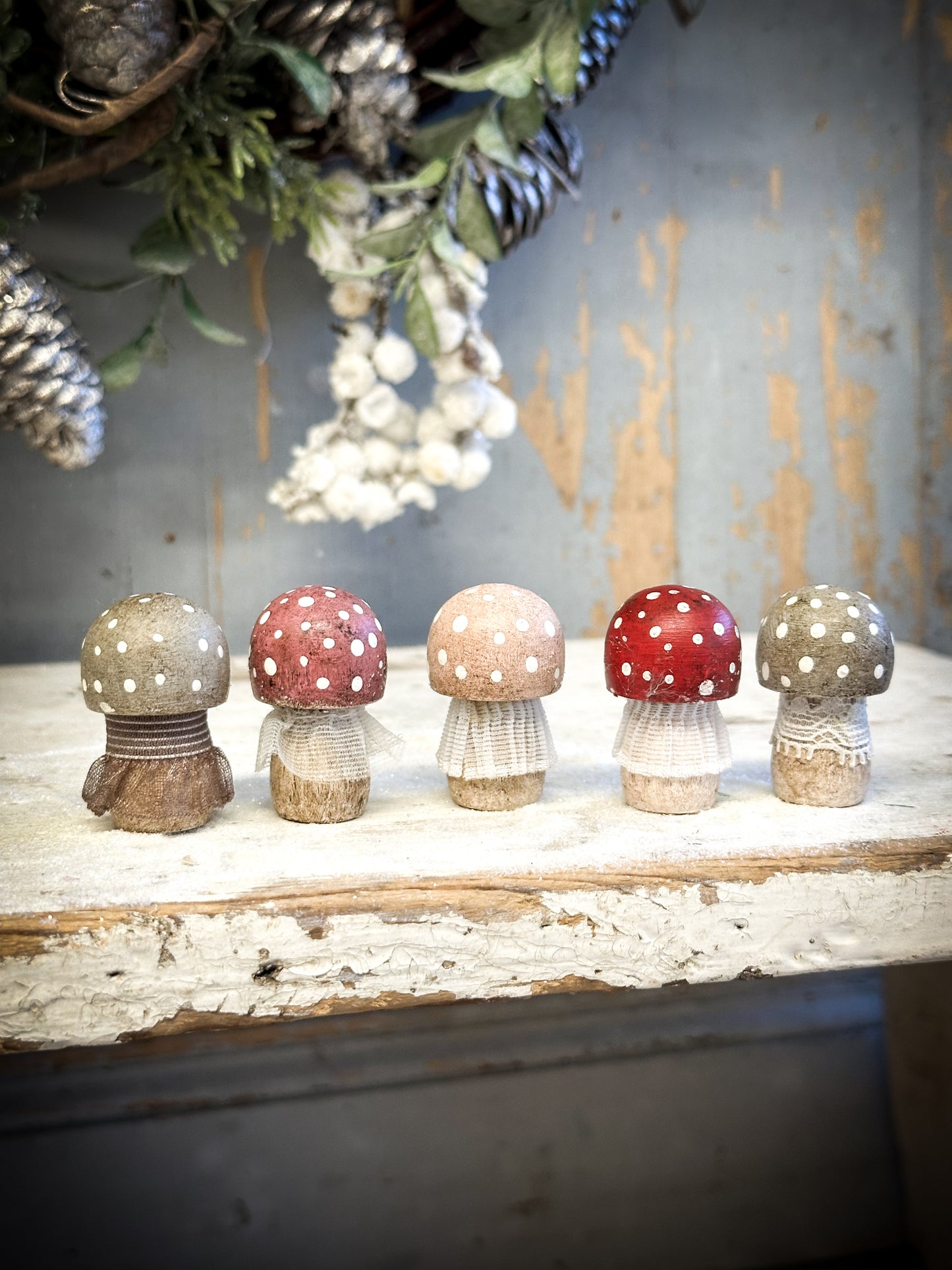 A wooden hand painted and trimmed Christmas village toadstool large capped one