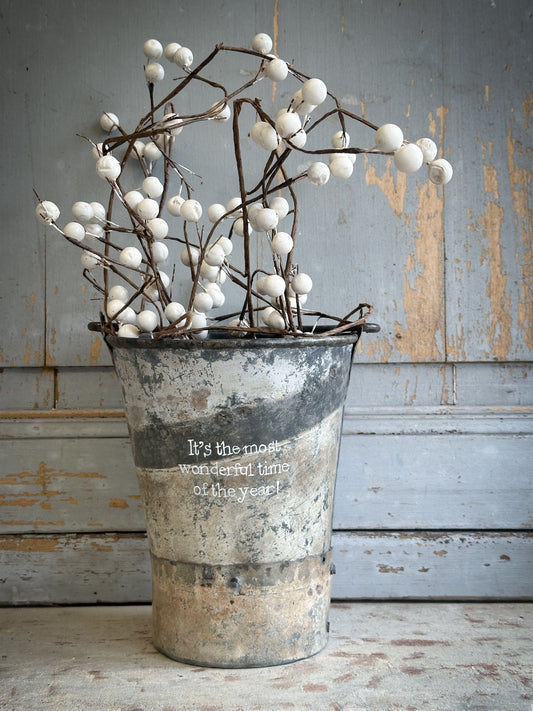 A Recycled Metal Mini Christmas Tree Bucket With A Hand Painted Quote