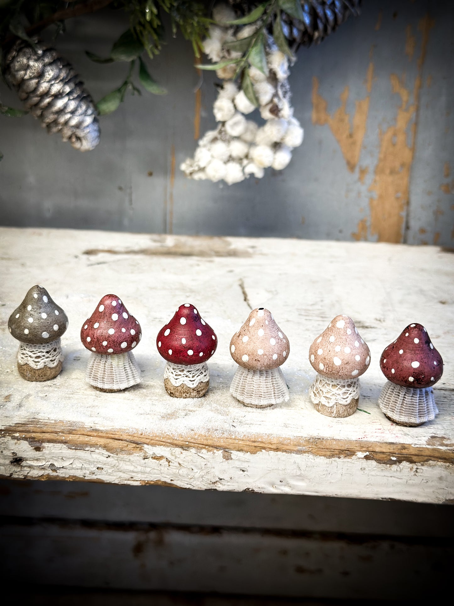 A wooden hand painted and trimmed Christmas village toadstool small pointy one