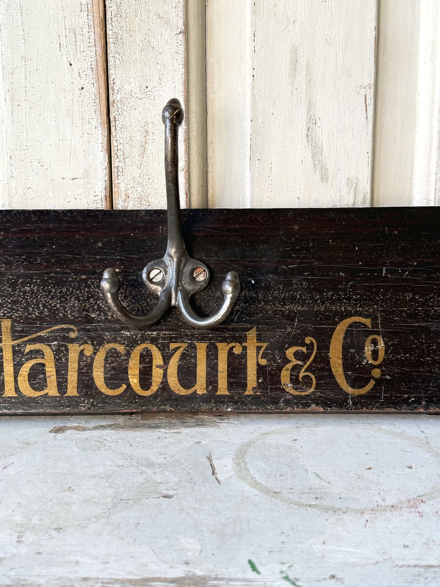 Salvaged sign written drawer front coat pegs