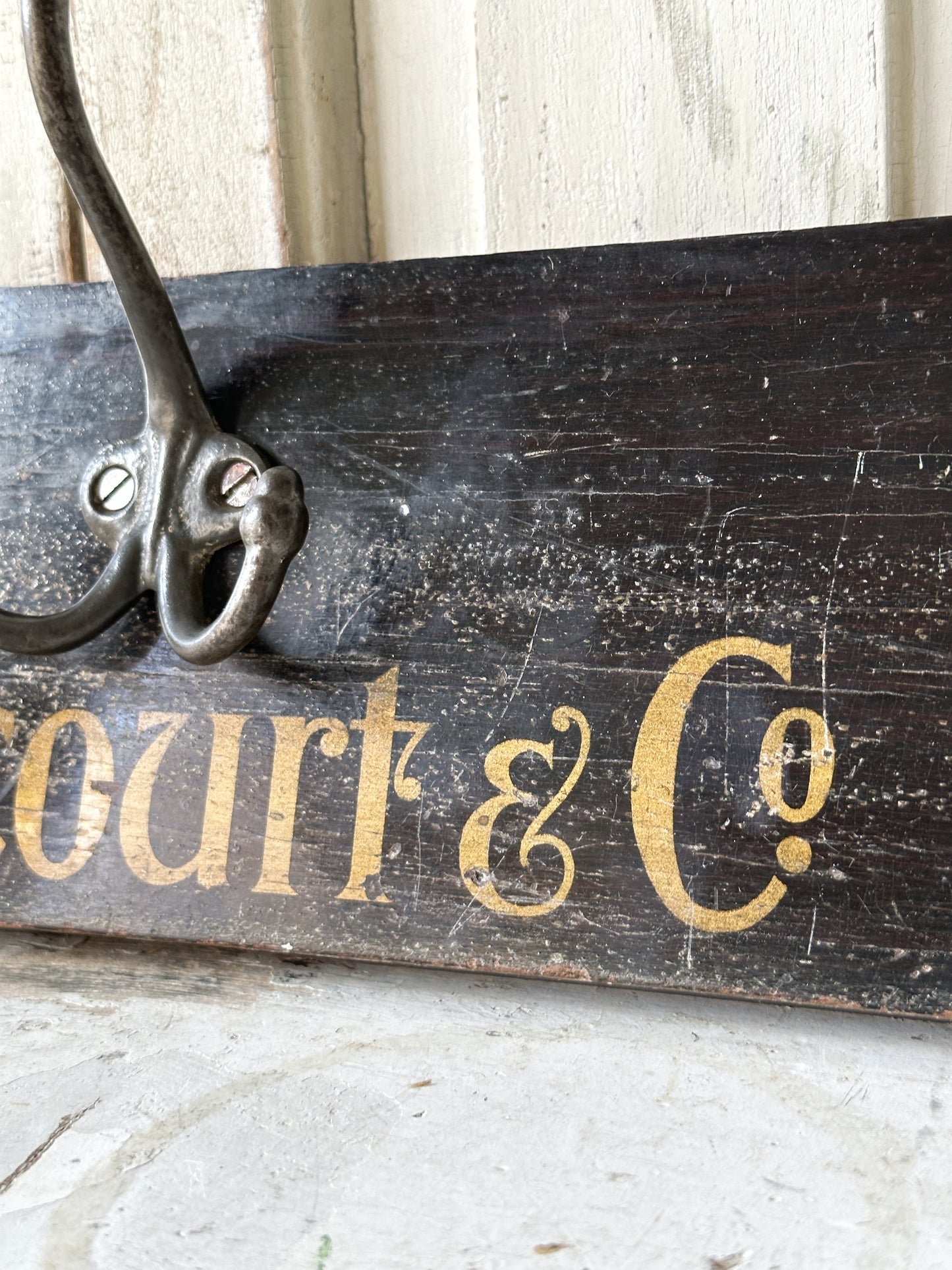 Salvaged sign written drawer front coat pegs