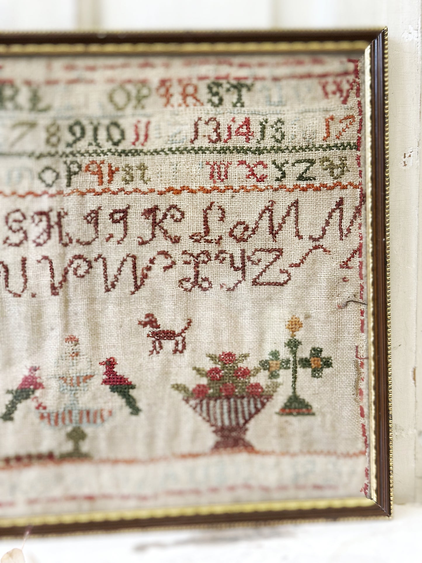 A beautiful 19th century colourful antique needlework sampler