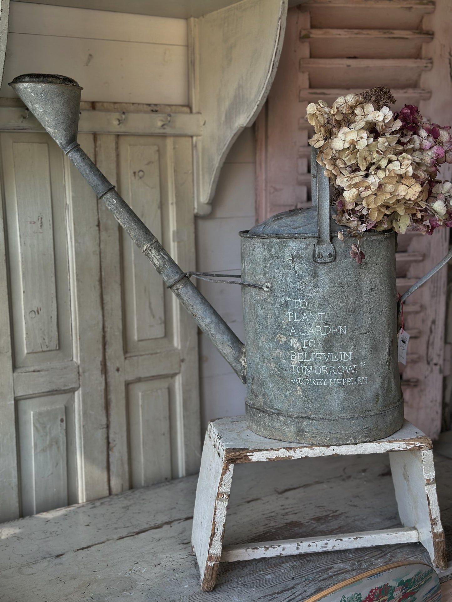 A beautiful vintage galvanised watering can planter