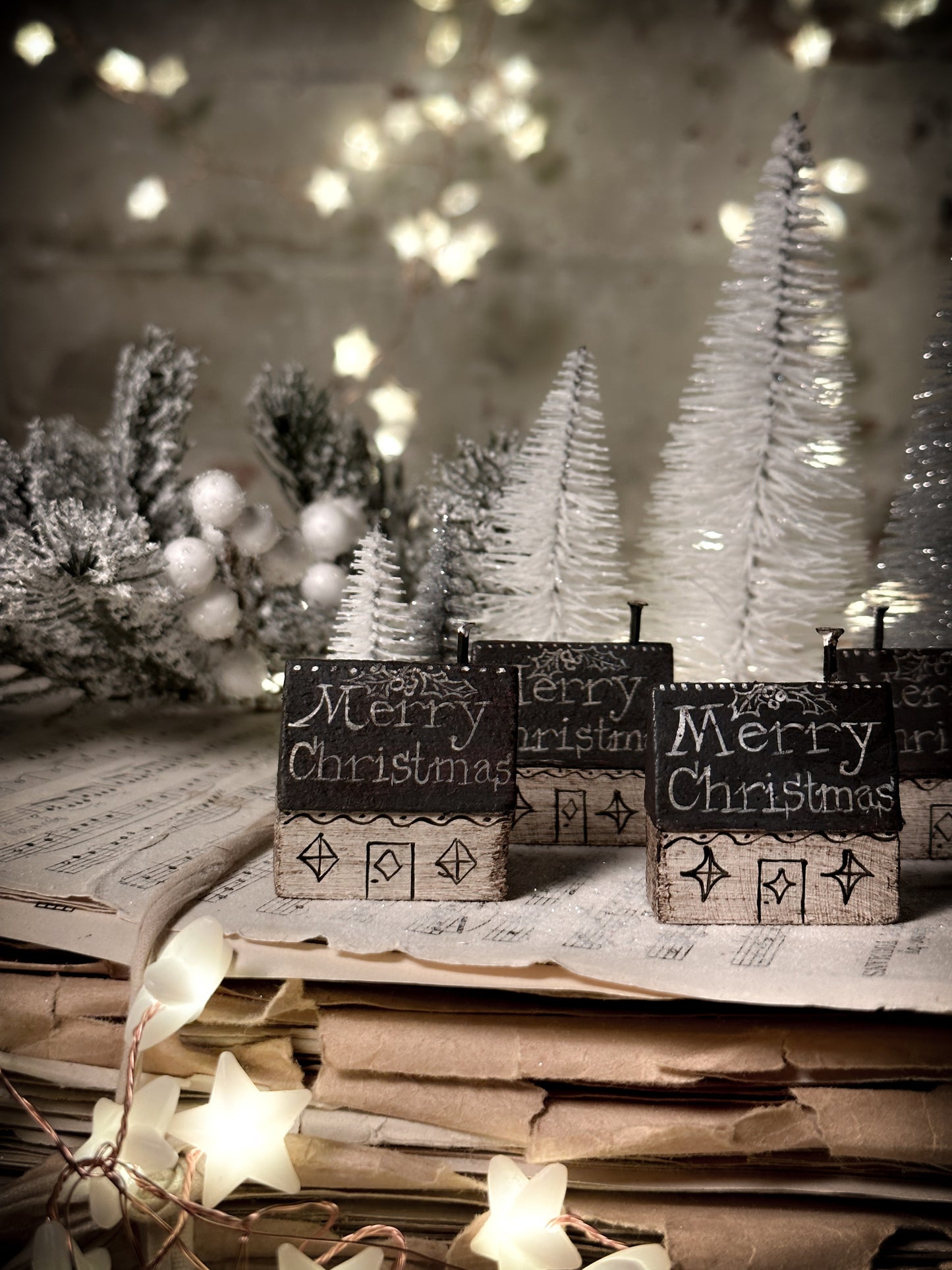 A pretty vintage German Erzgebirge Putz wooden village house painted with a Christmas quote