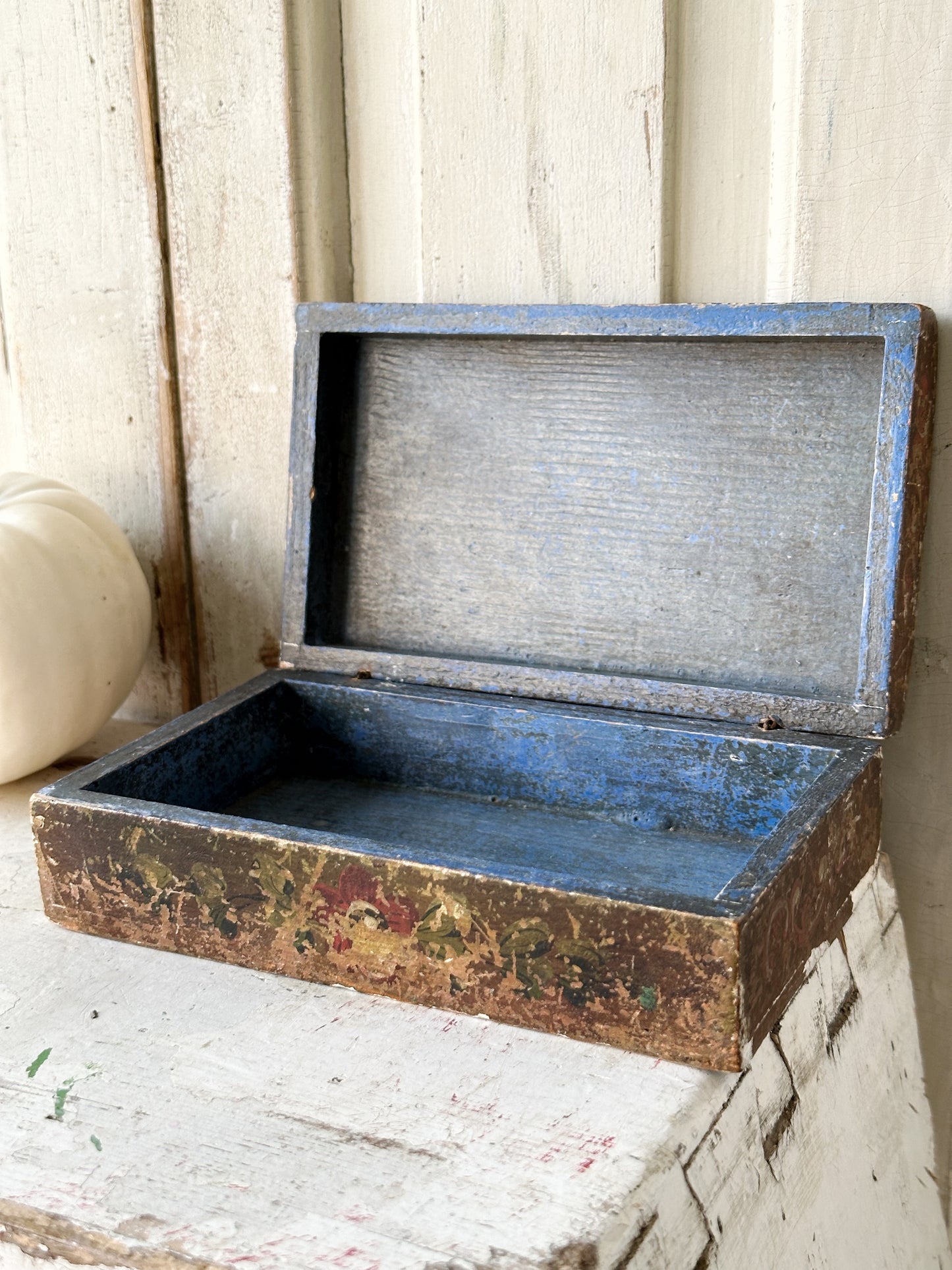 A beautiful antique painted box with floral detail