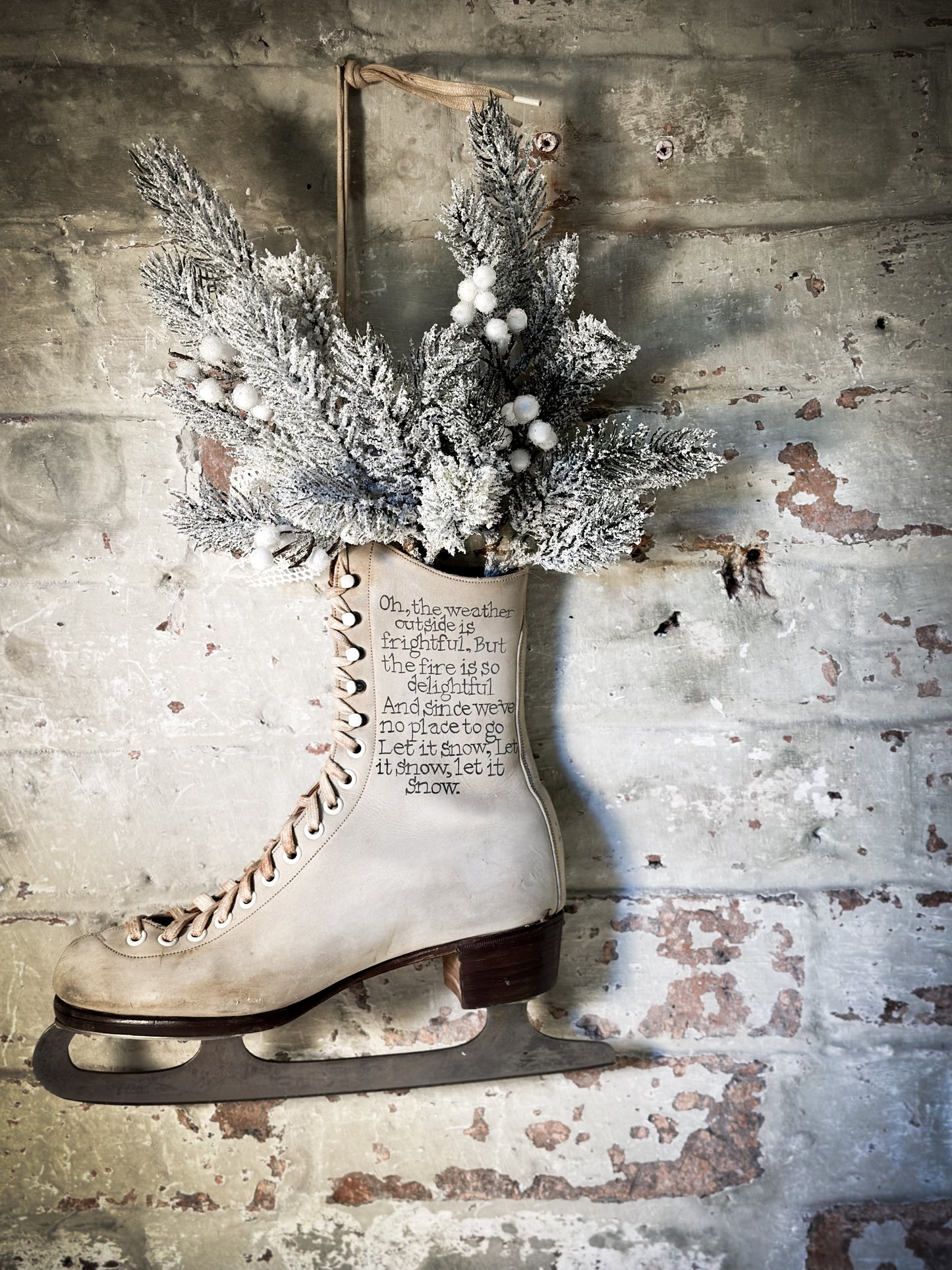 A beautiful vintage Christmas ice skate hand painted using traditional sign writer’s techniques and materials