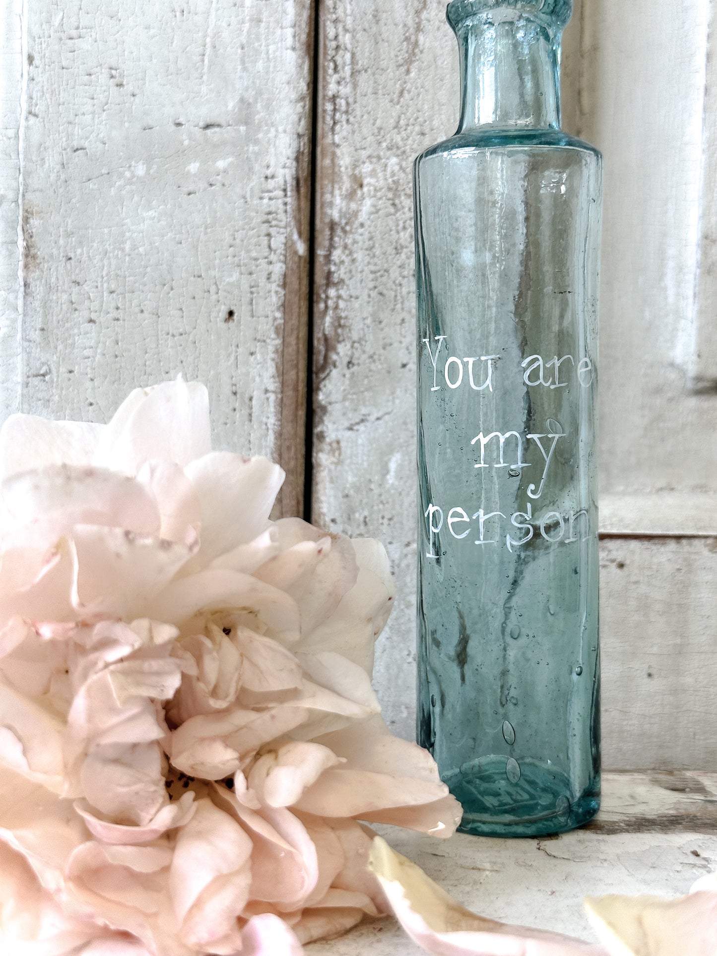 A beautiful Victorian bottle with a hand painted quote