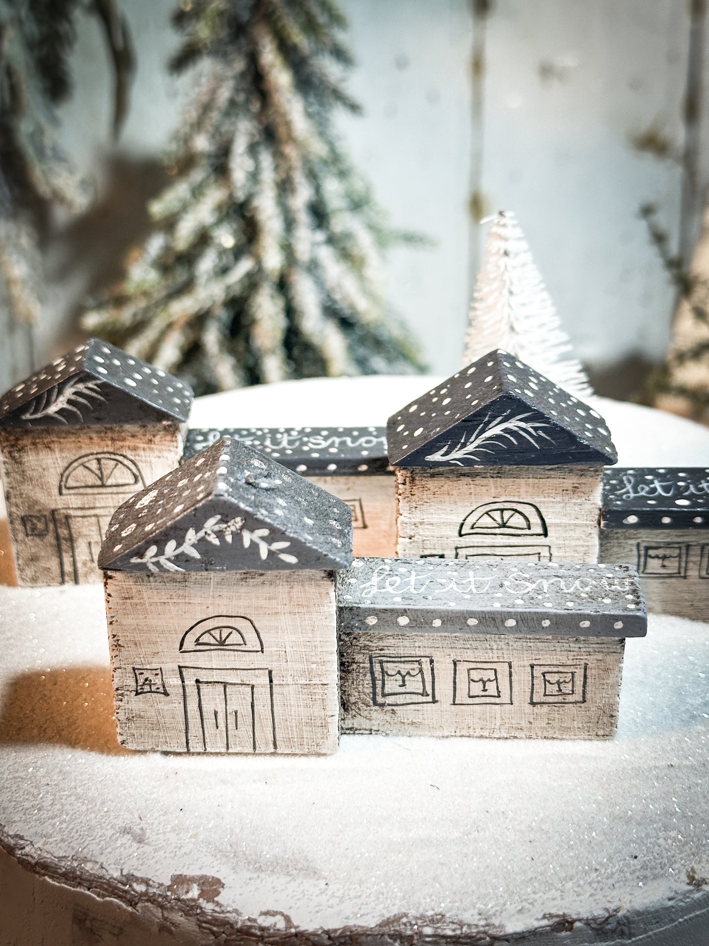 A pretty vintage German Erzgebirge Putz wooden village house painted with a Christmas quote