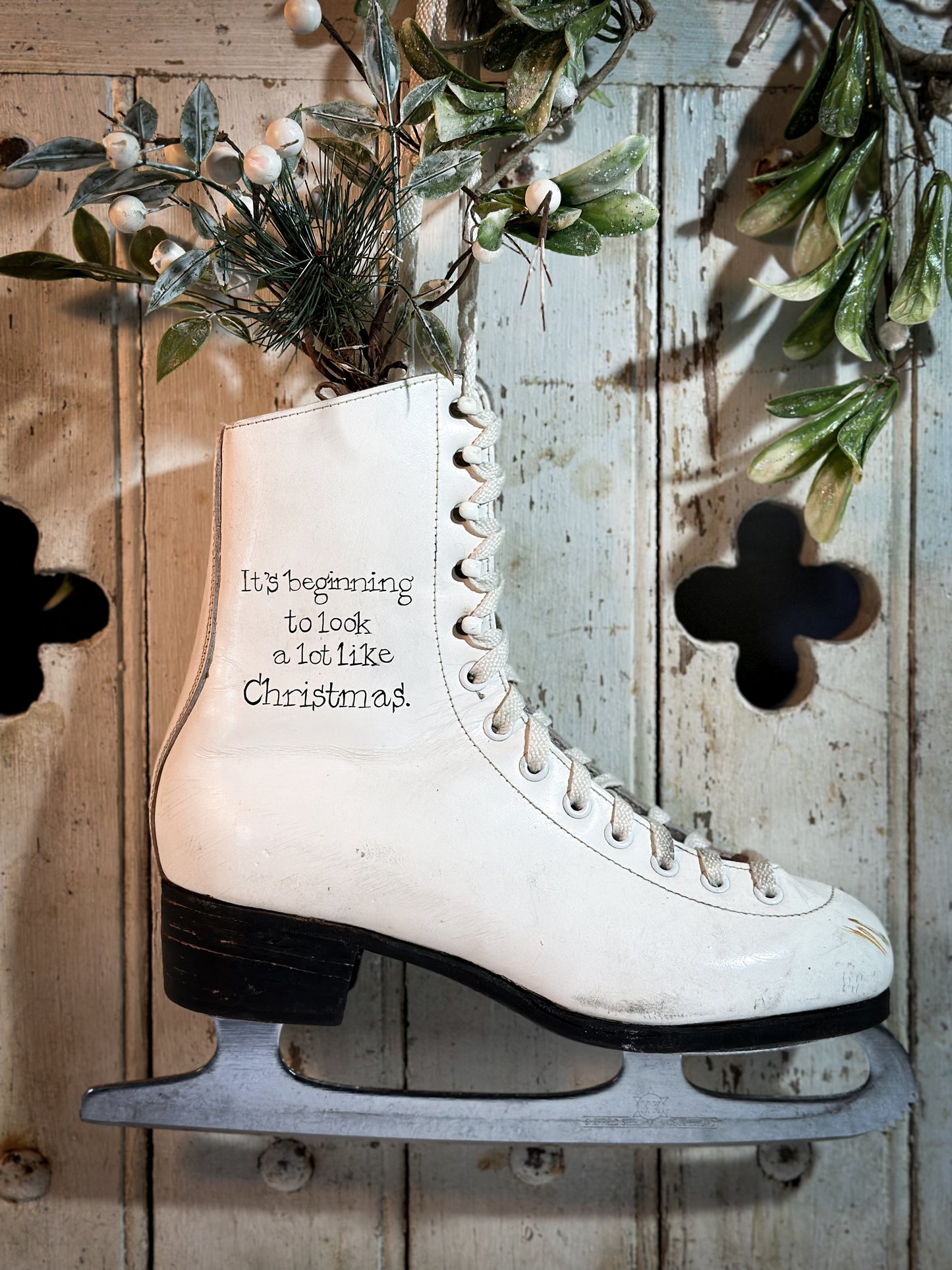 A beautiful vintage Christmas ice skate hand painted using traditional sign writer’s techniques and materials