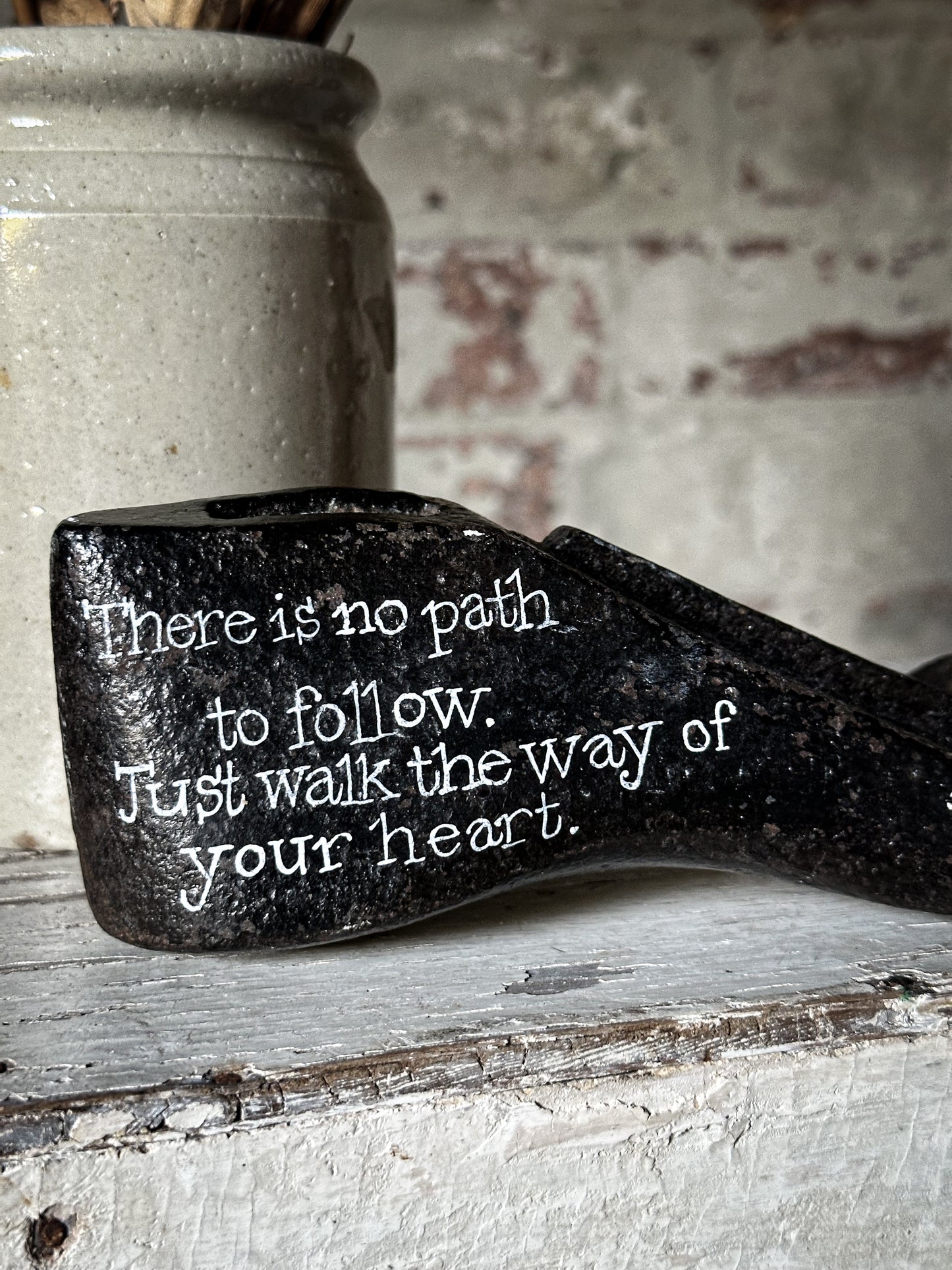 An antique cast iron painted adult’s shoe last.