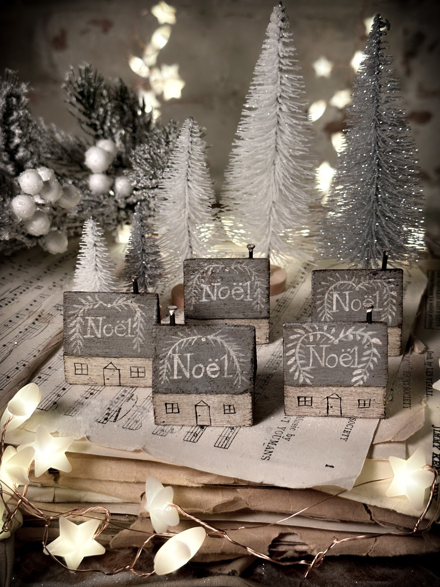 A pretty vintage German Erzgebirge Putz wooden village house painted with a Christmas quote