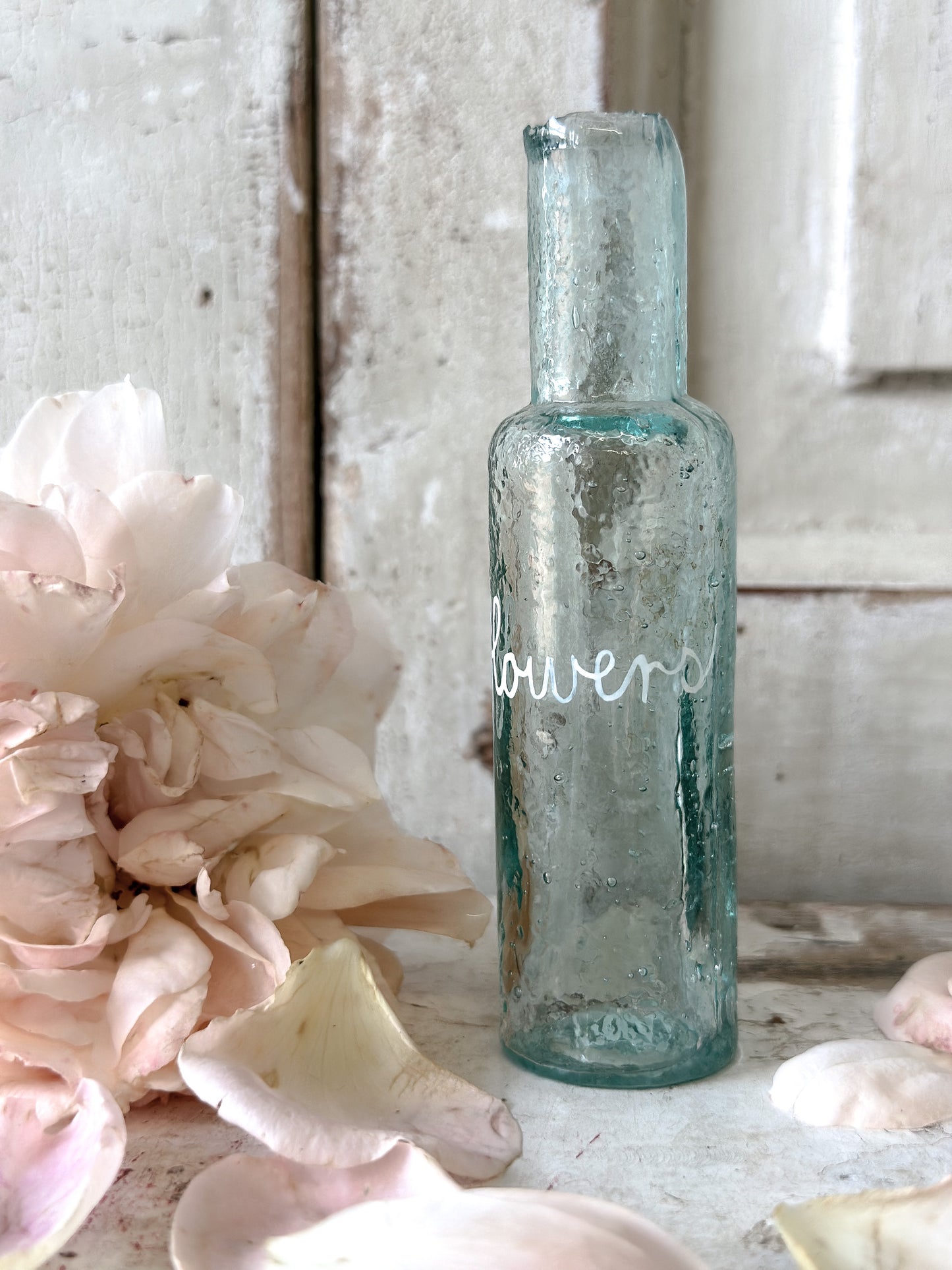 A beautiful Victorian bottle with a hand painted quote