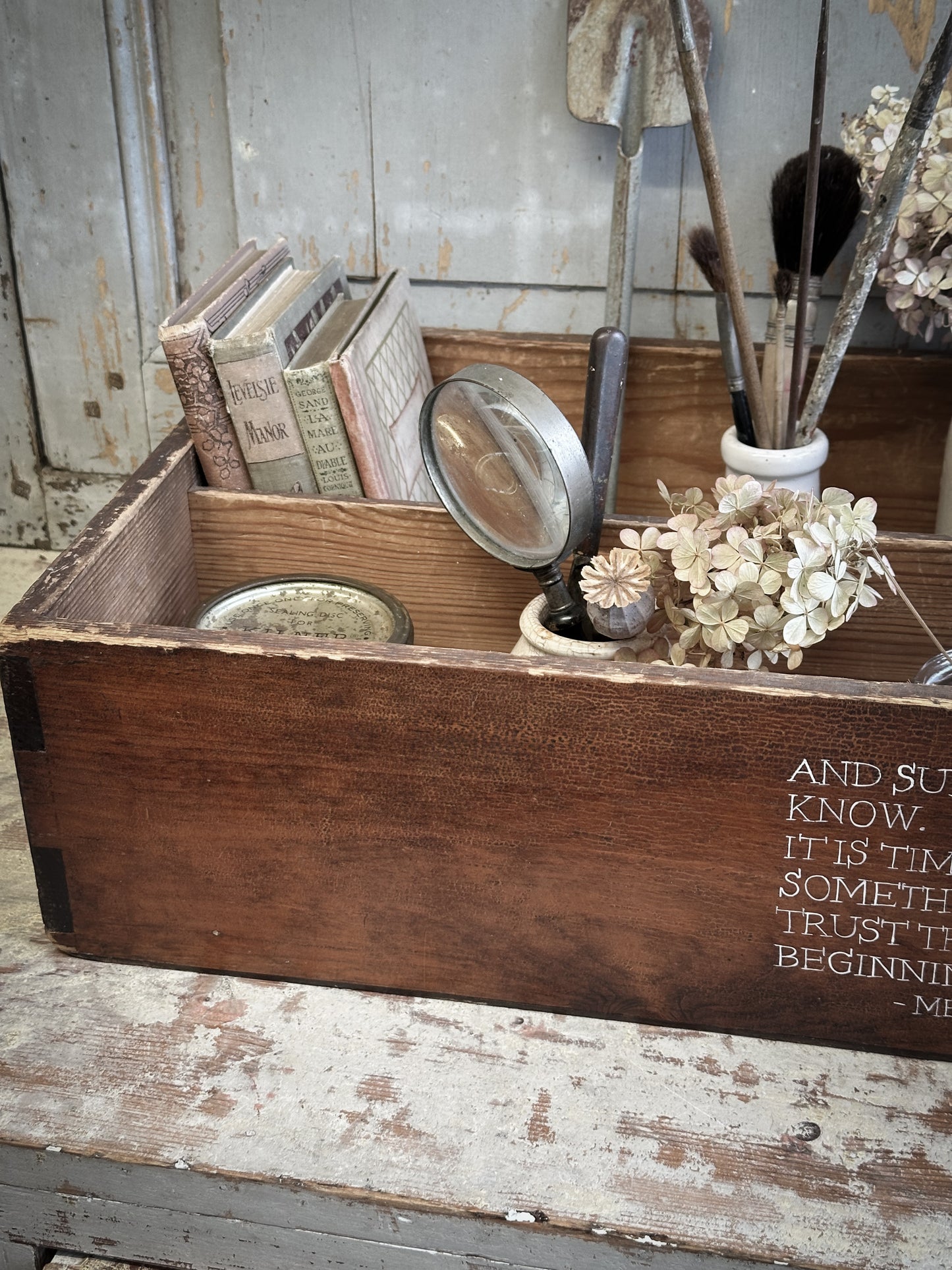 A Vintage Wooden Drawer With Hand Painted Quote