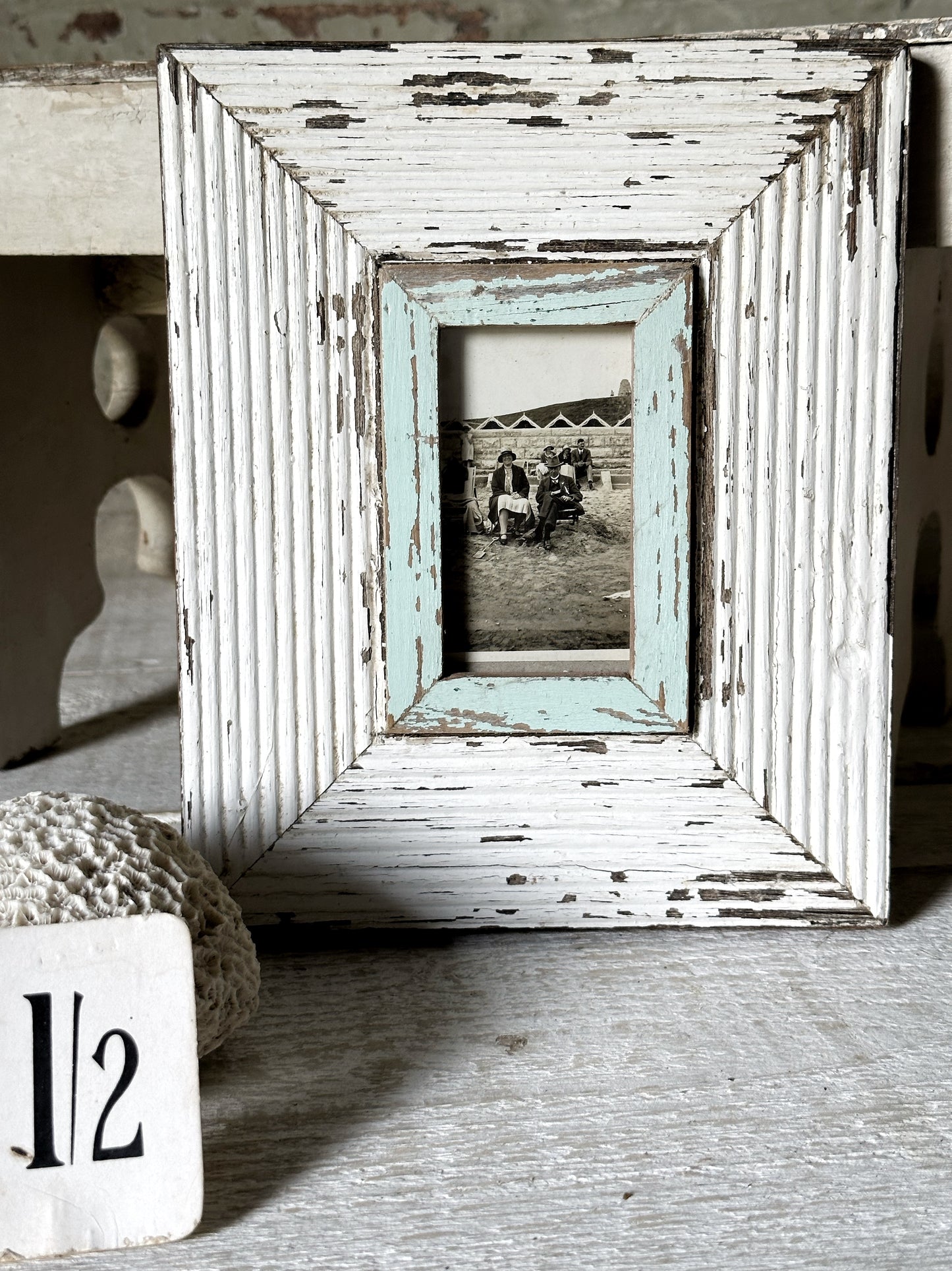A framed day at the seaside antique photograph in a Luna design frame