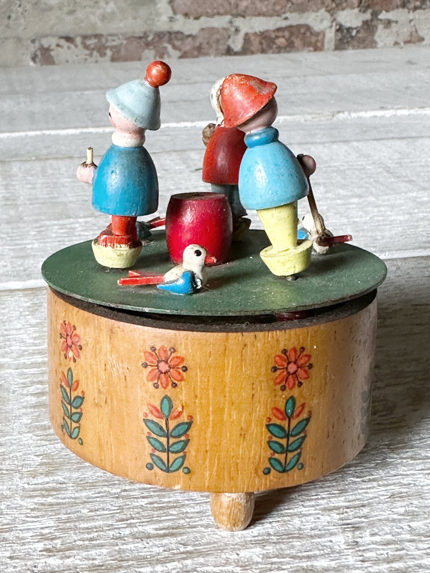 A vintage German Erzgebirge wooden Folkart musical merry-go-round