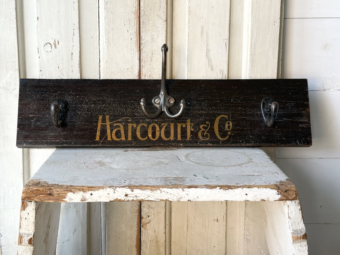 Salvaged sign written drawer front coat pegs