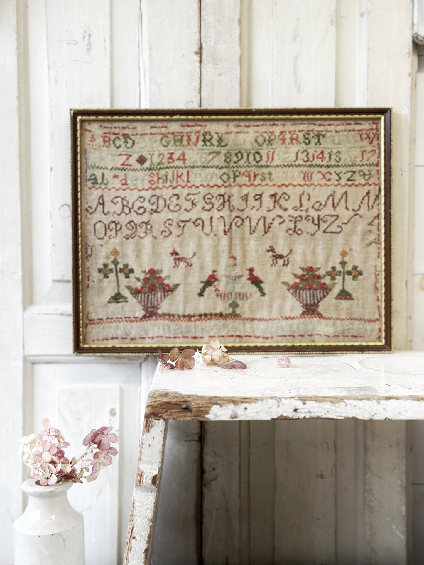 A beautiful 19th century colourful antique needlework sampler