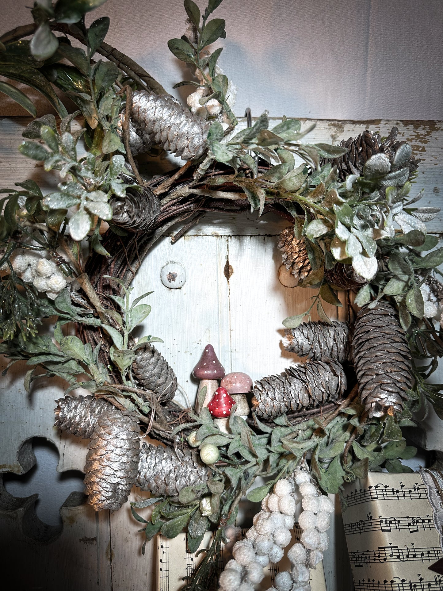 A wooden hand painted Christmas village toadstool
