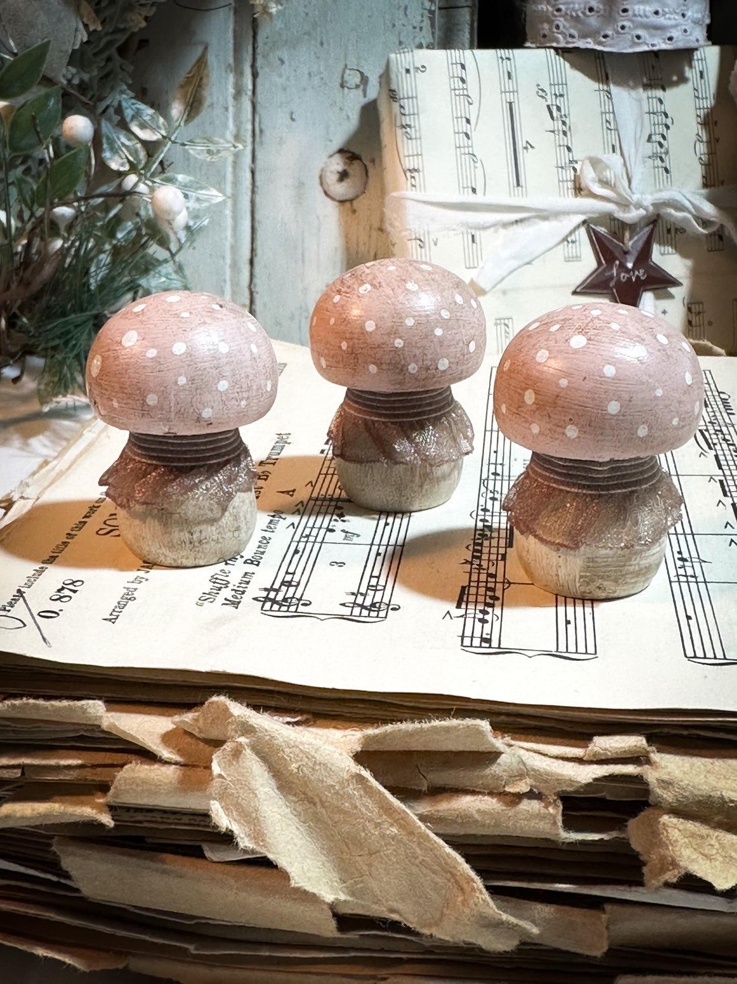 A wooden hand painted and trimmed Christmas village toadstool