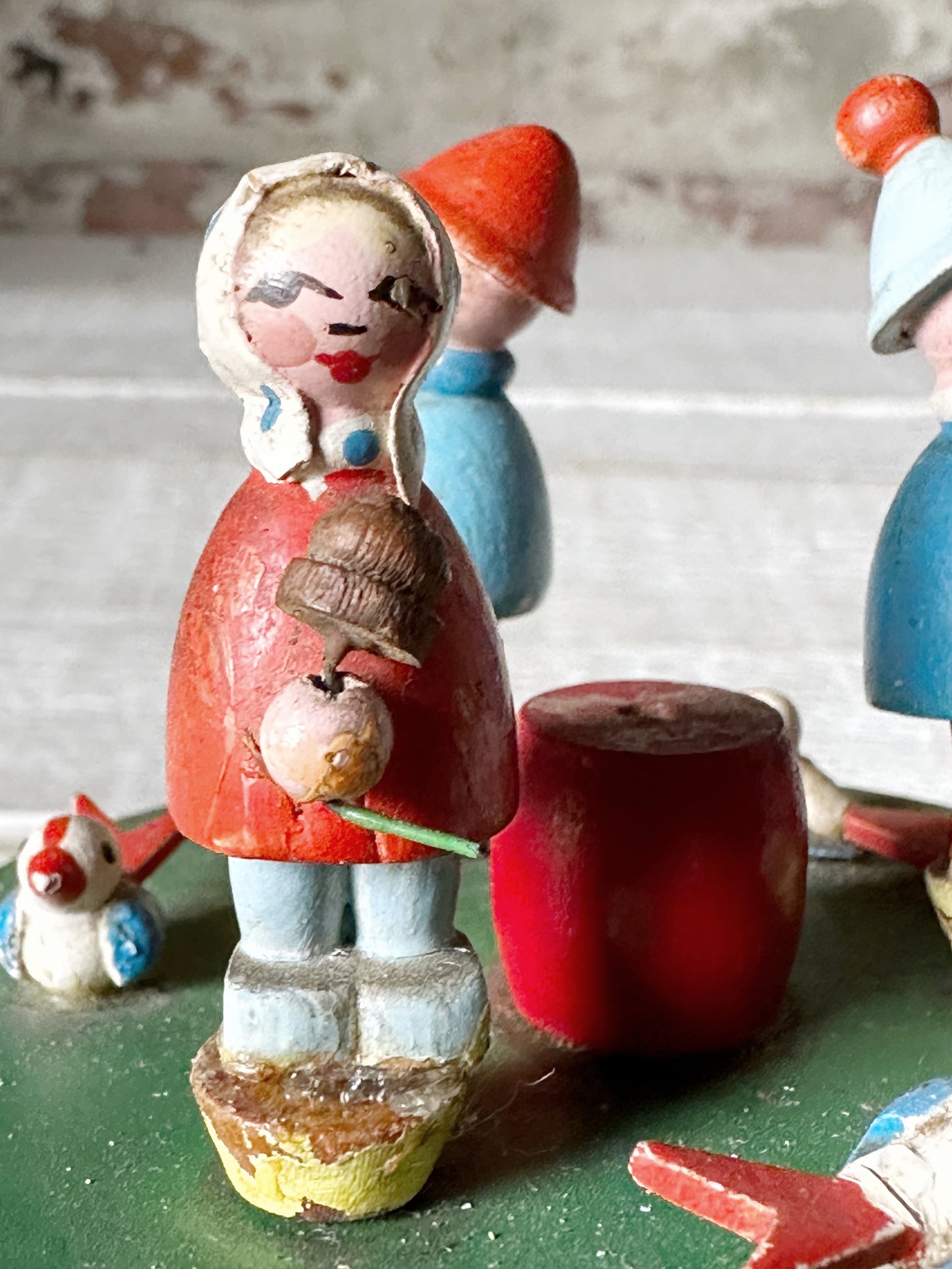 A vintage German Erzgebirge wooden Folkart musical merry-go-round