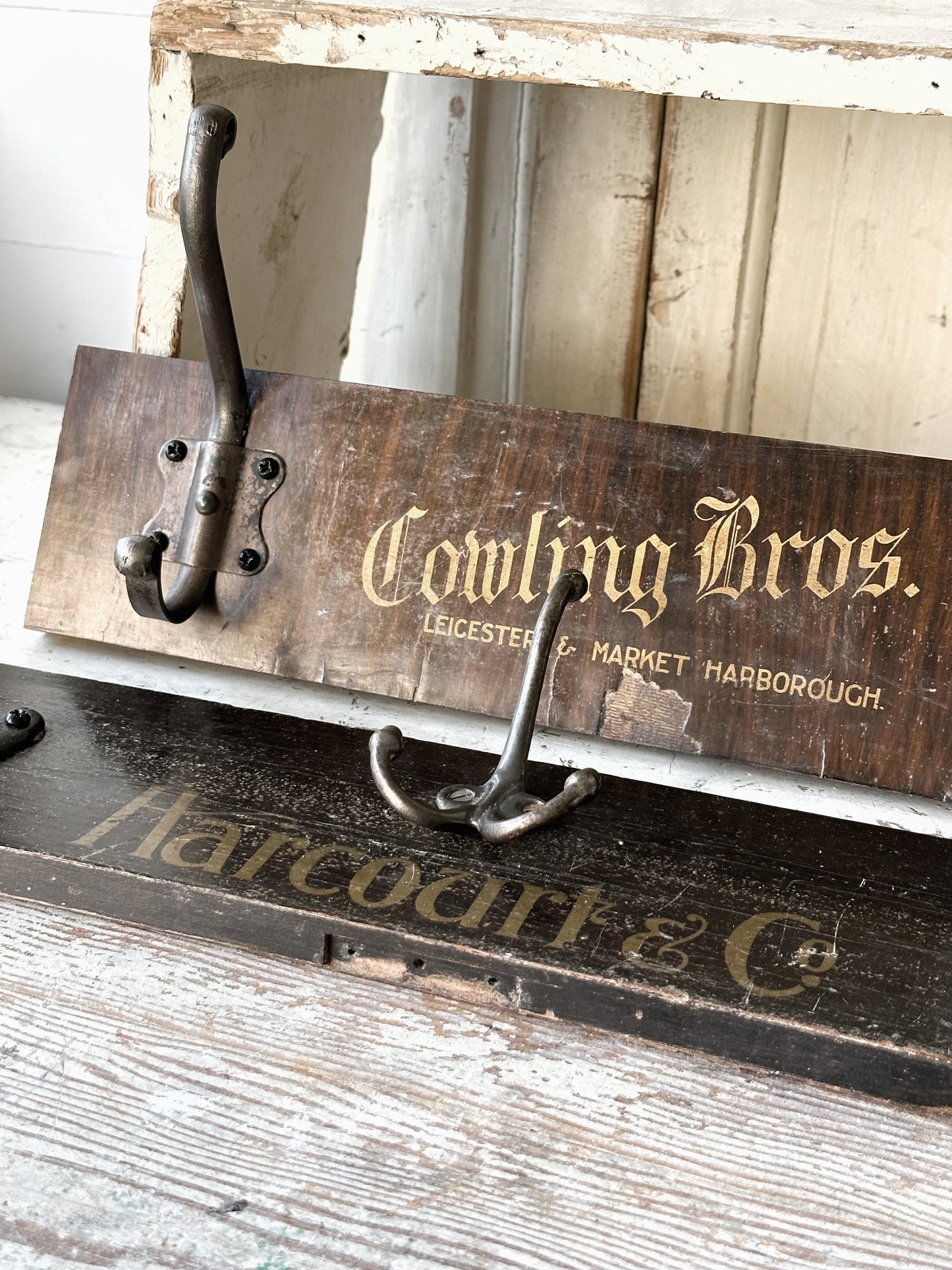 Salvaged sign written drawer front coat pegs