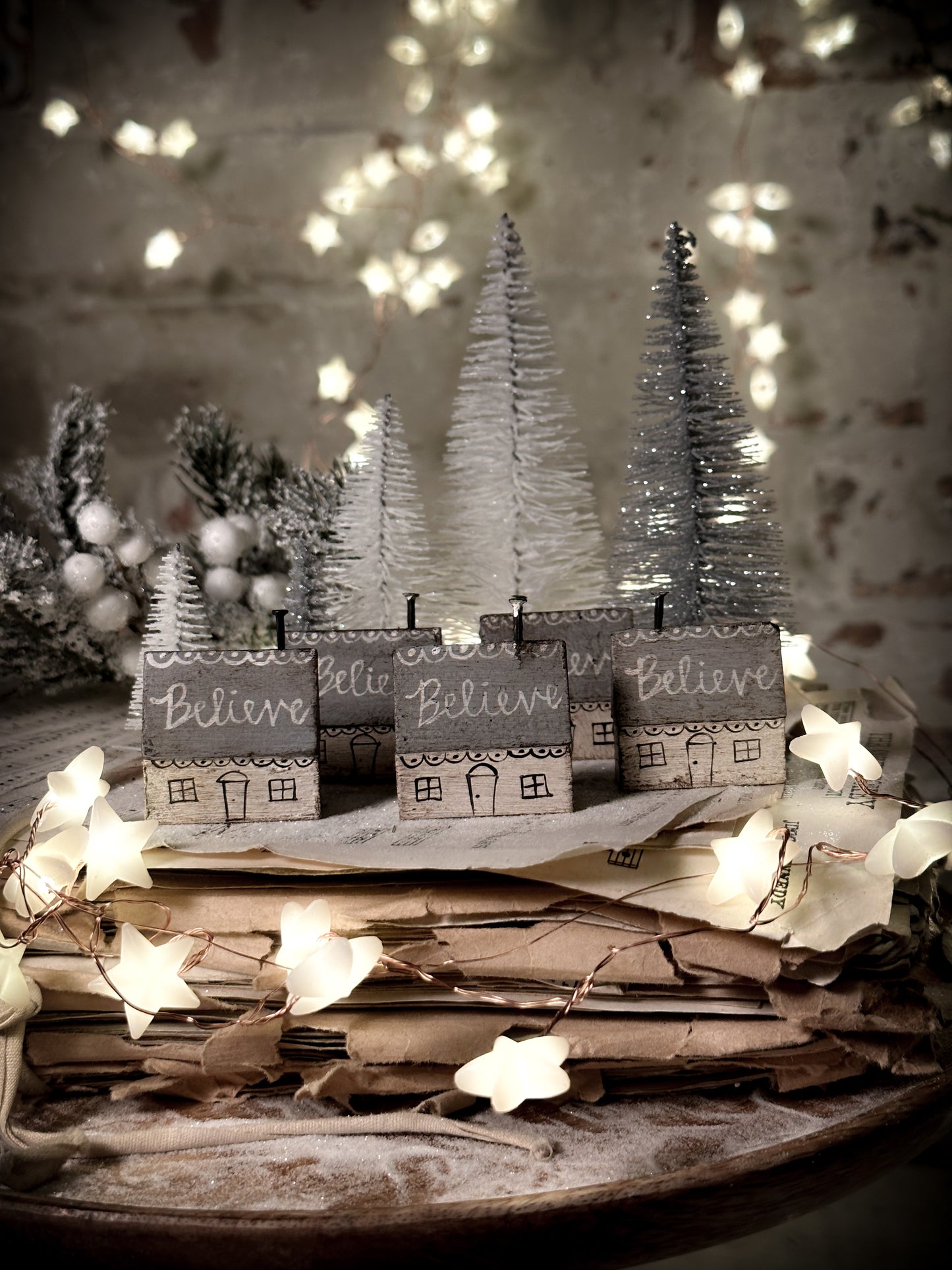 A pretty vintage German Erzgebirge Putz wooden village house painted with a Christmas quote