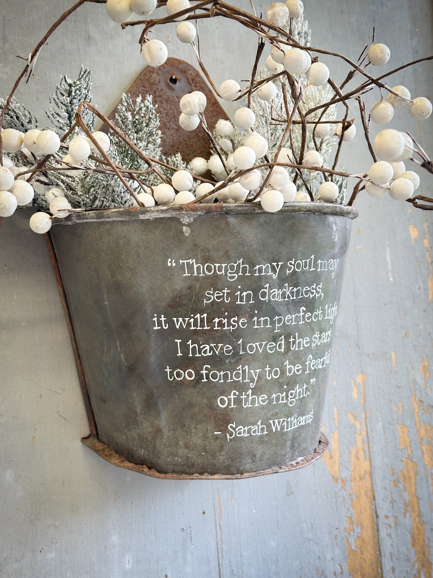 A Recycled Metal Candle Store With A Hand Painted Quote
