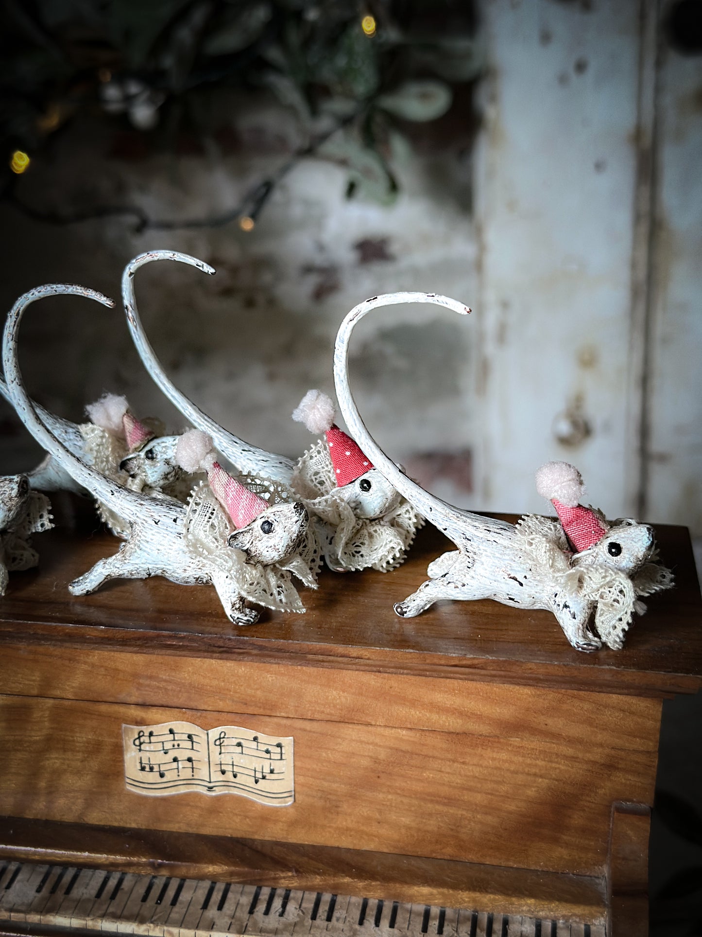 A cold painted brass “night before Christmas mouse” with a lace ruffle and Christmas hat