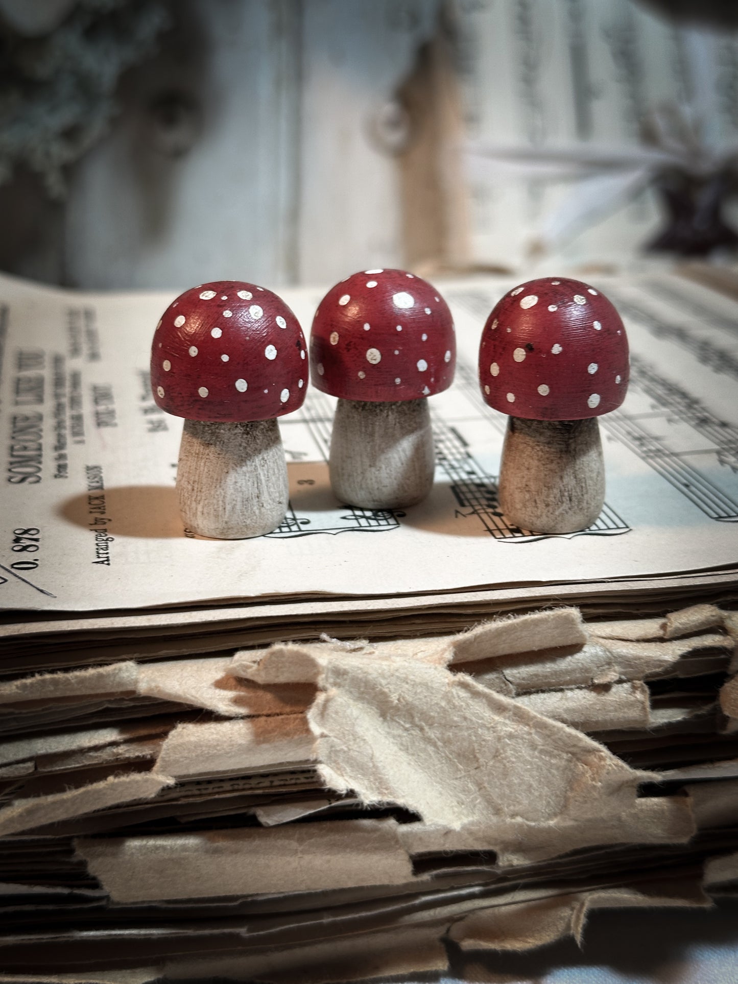 A wooden hand painted Christmas village toadstool