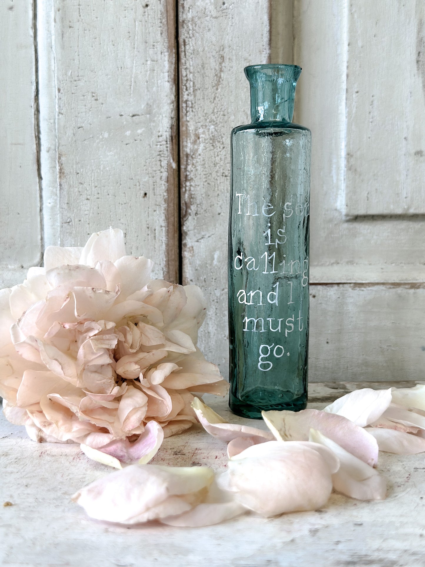 A beautiful Victorian bottle with a hand painted quote