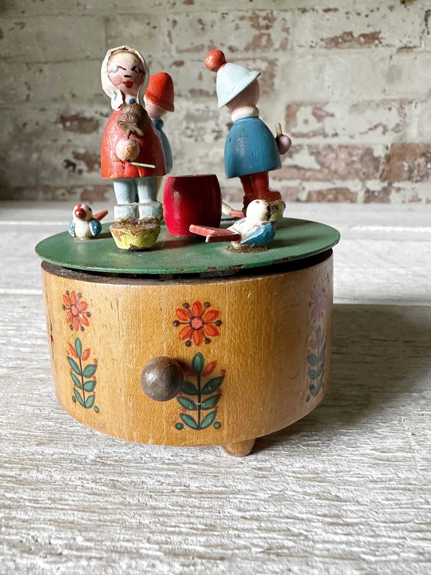 A vintage German Erzgebirge wooden Folkart musical merry-go-round