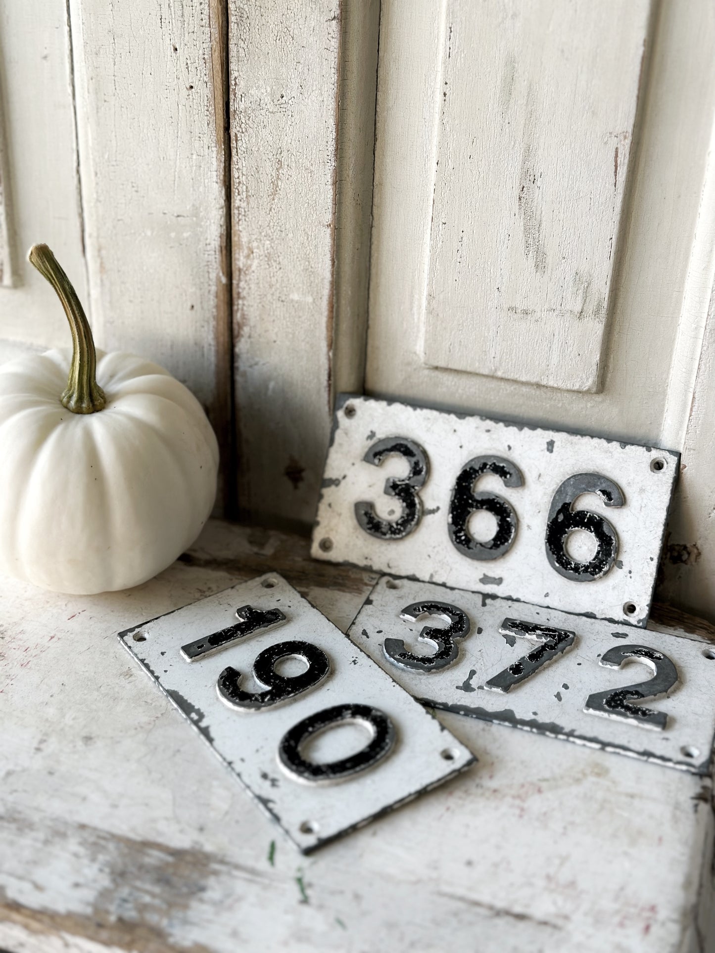 Three vintage French cast iron signs locker numbers