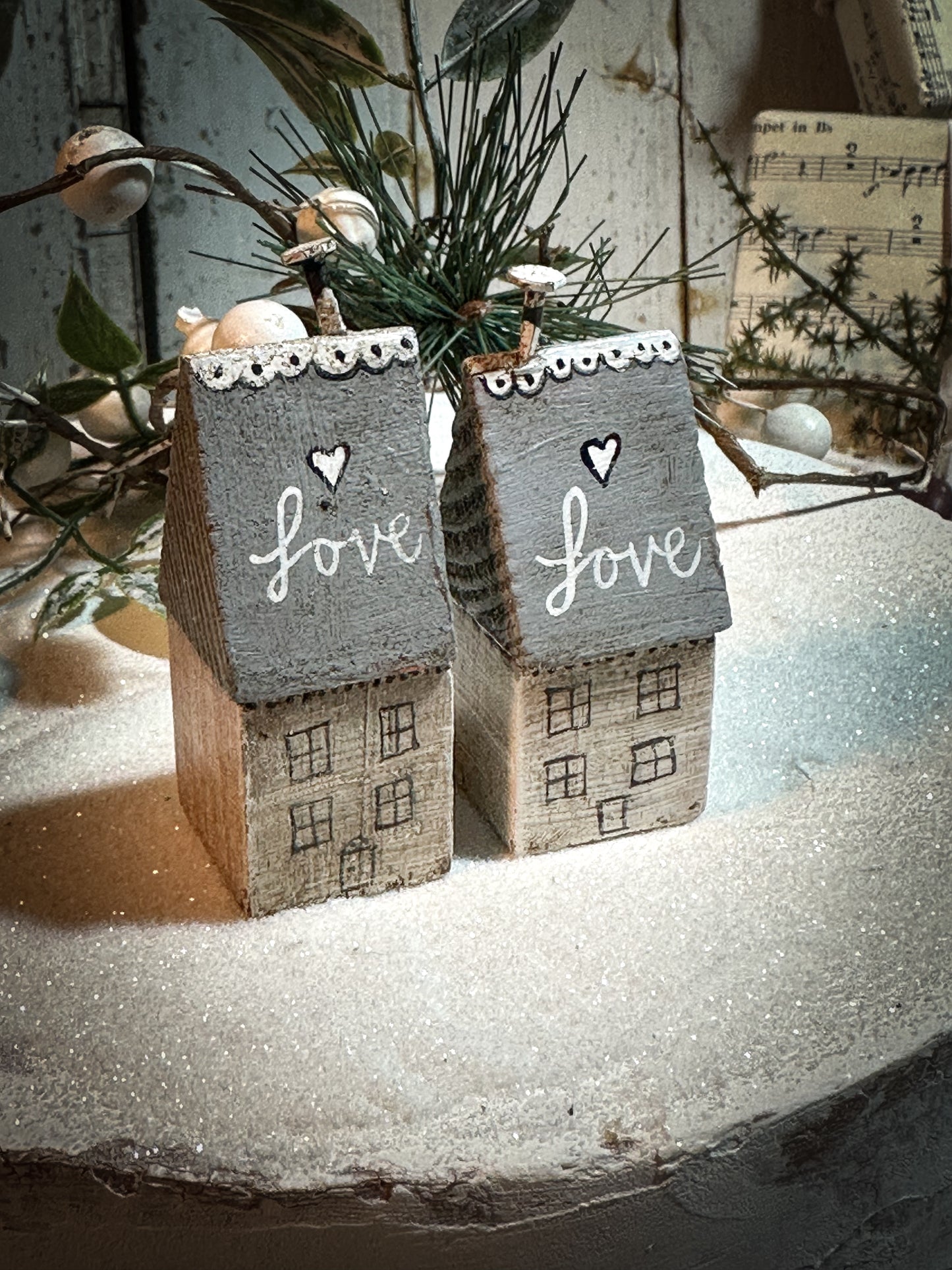 A pretty vintage German Erzgebirge Putz wooden village house painted with a Christmas quote