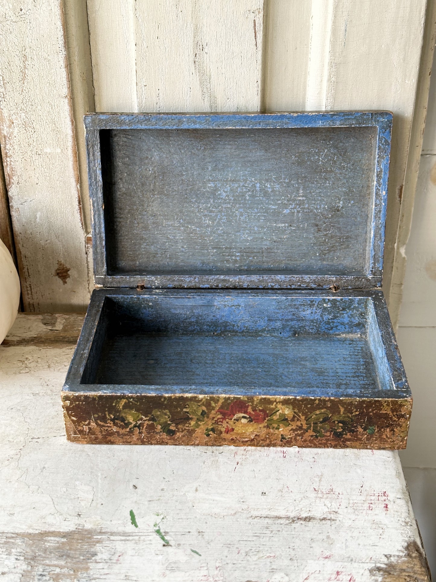 A beautiful antique painted box with floral detail