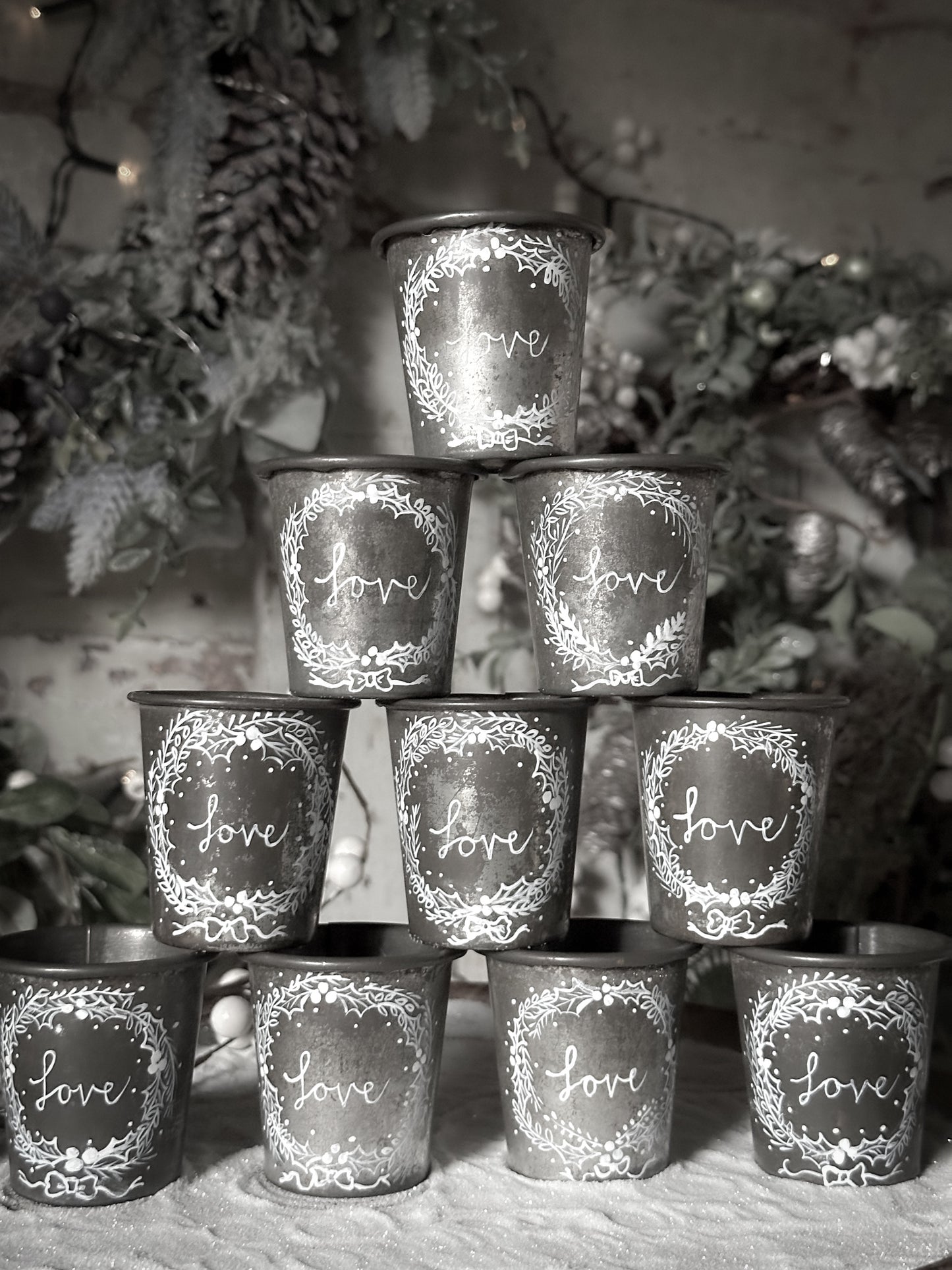 A pretty hand painted Dariole tin tea light holder