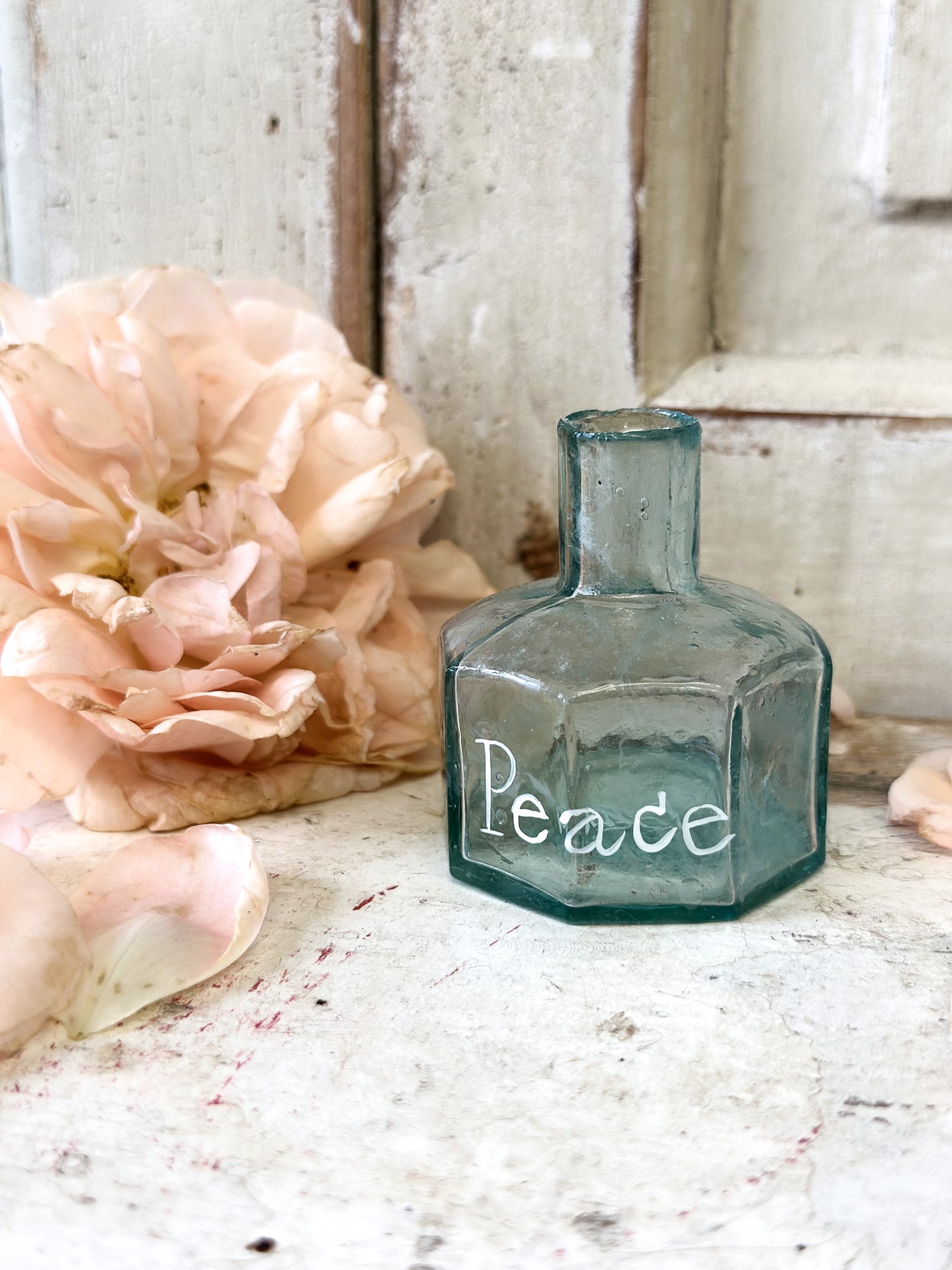 A beautiful Victorian bottle with a hand painted quote