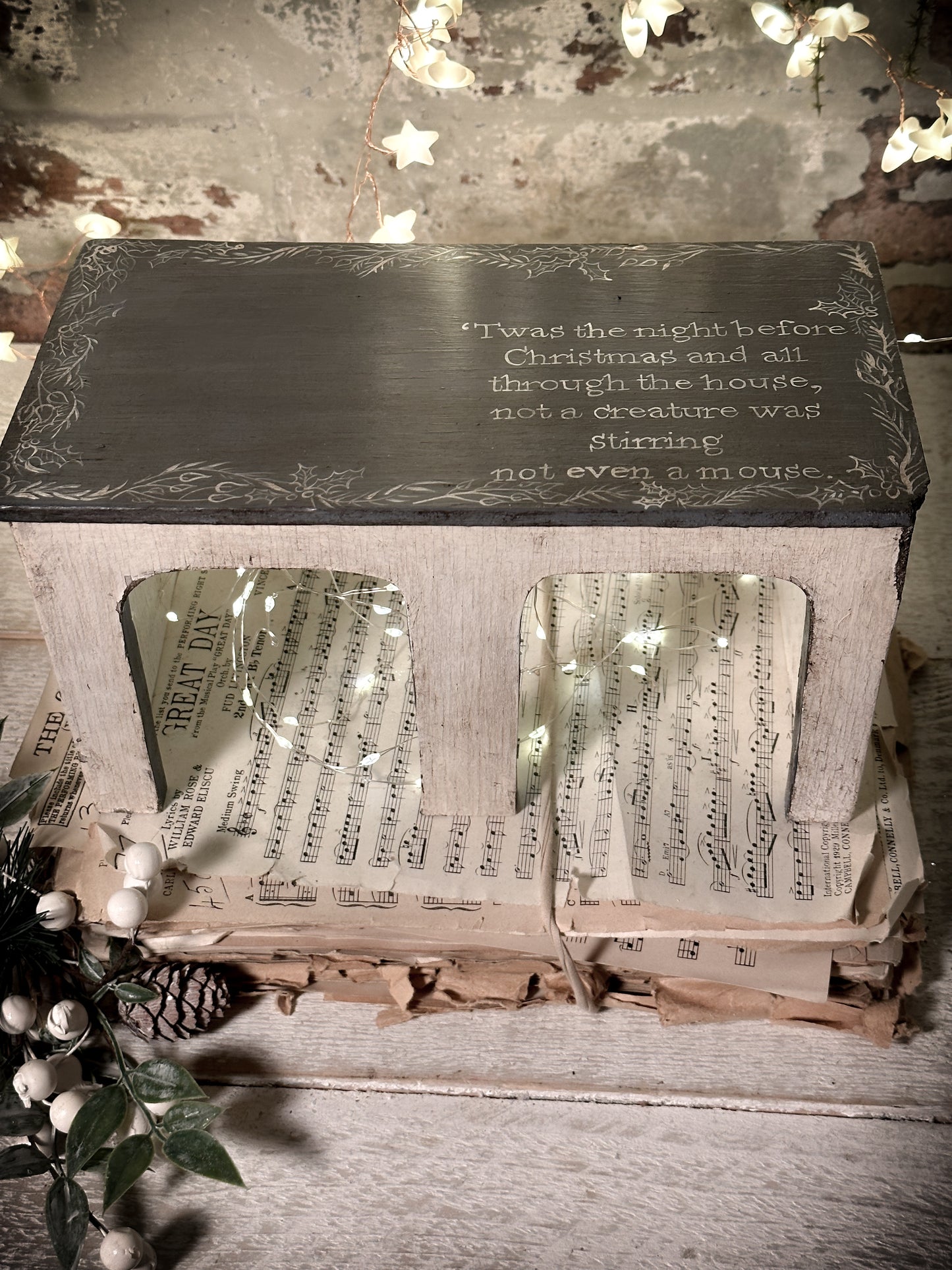 A hand painted quote on a vintage scratch built folk art model farm barn