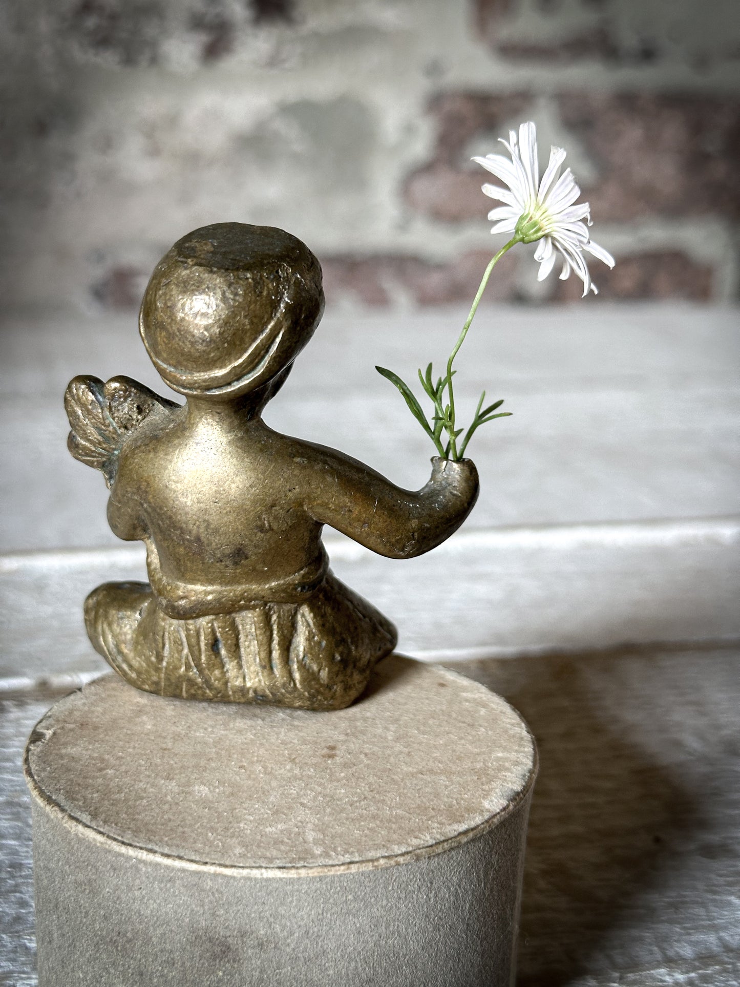 A Delightful Antique Bronze Decorative Seated Cherub