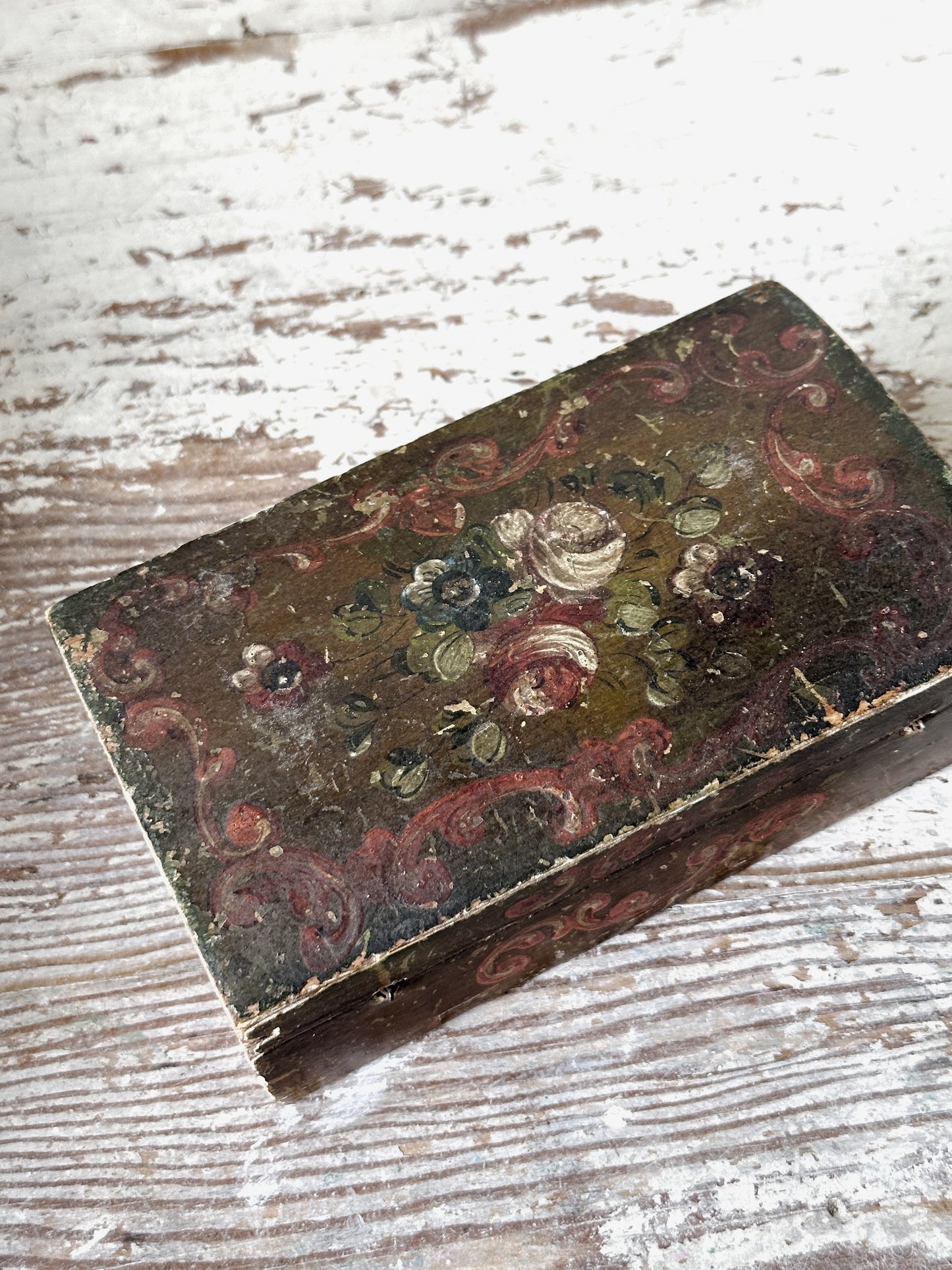 A beautiful antique painted box with floral detail